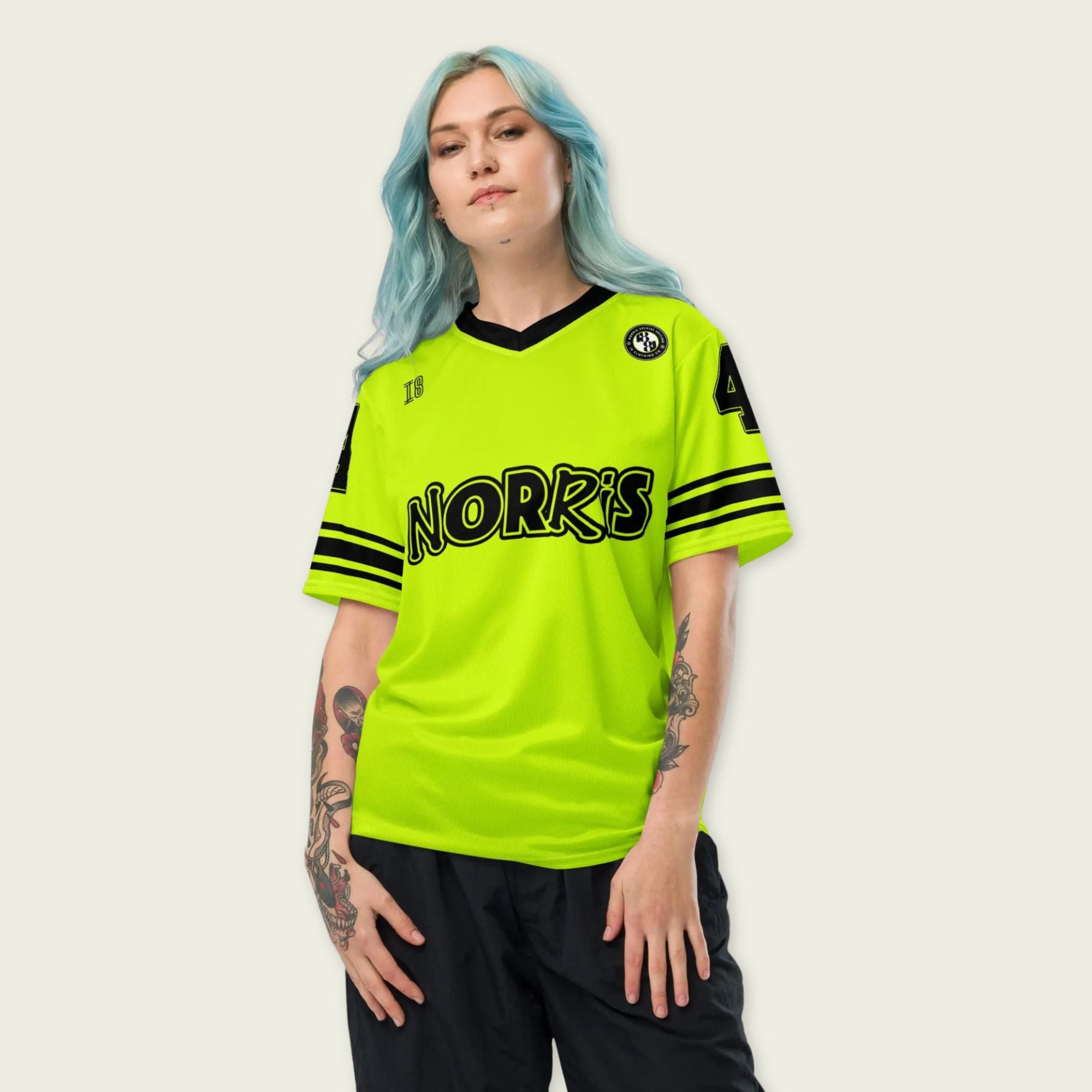 A neon green and black football jersey with Lando Norris's McLaren F1 racing number 4 on the back and front in black. It has the name Norris in black on the front and back as well.