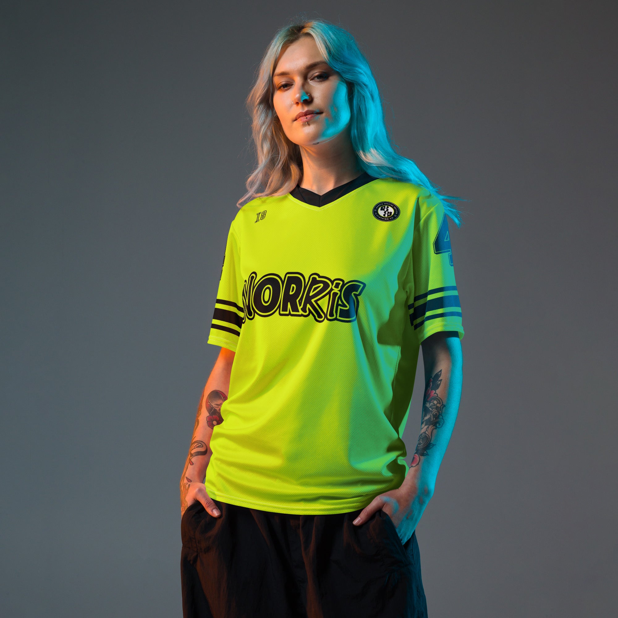 A neon green and black football jersey with Lando Norris's McLaren F1 racing number 4 on the back and front in black. It has the name Norris in black on the front and back as well.