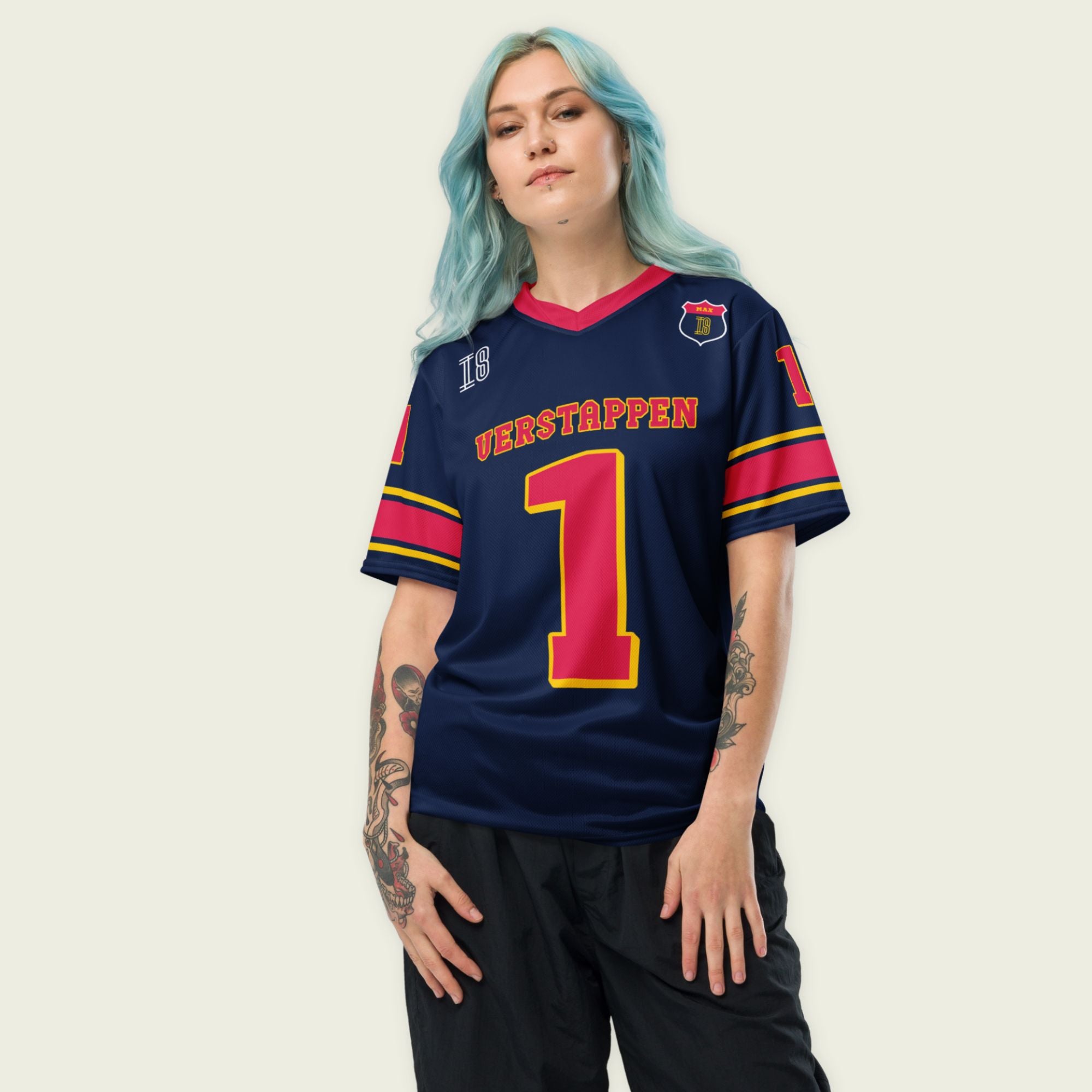A navy blue and red football jersey with  Max Verstappen's Redbull F1 racing number 1 on the front and back.