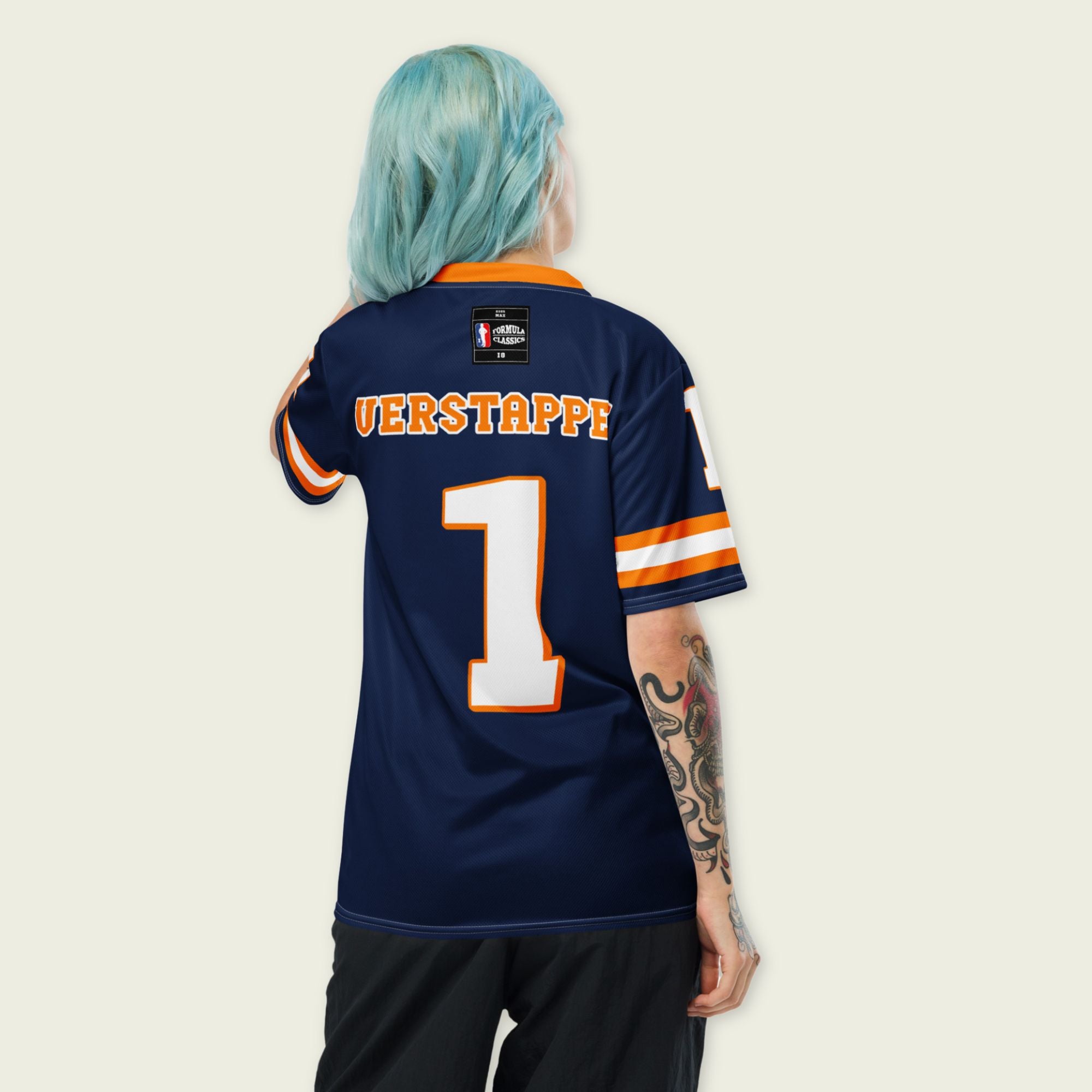 A Navy, orange and white football jersey with Mac Verstappen's Redbull F1 Racing number 1 on the front and back.