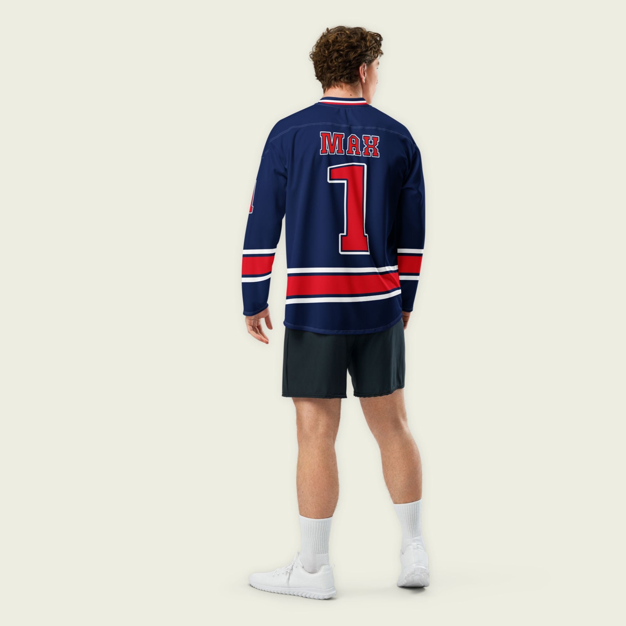 A navy blue and redhockey jersey with orange stripes at the bottom, and Max Verstappen's F1 racing number 1 on the front and back.