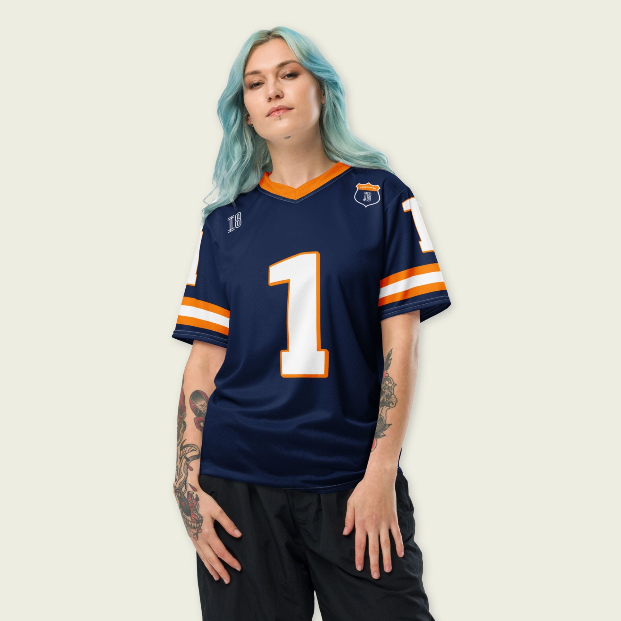 A Navy, orange and white football jersey with Mac Verstappen's Redbull F1 Racing number 1 on the front and back.
