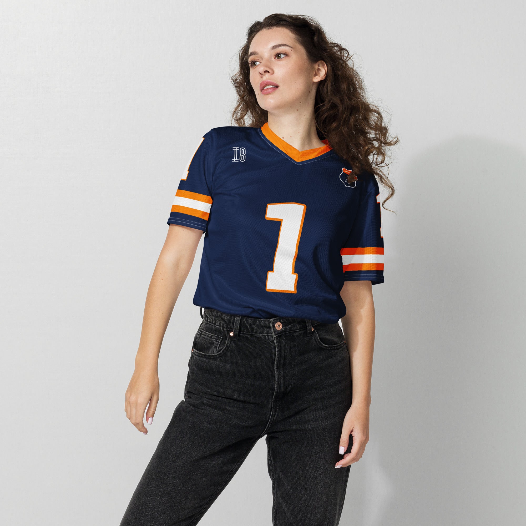 A Navy, orange and white football jersey with Mac Verstappen's Redbull F1 Racing number 1 on the front and back.
