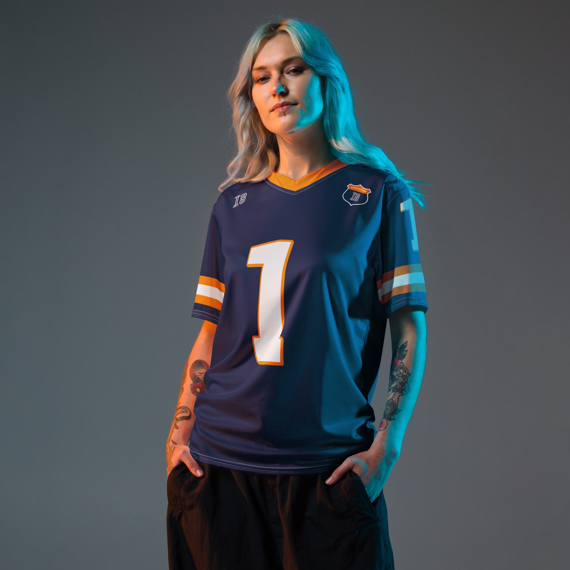 A Navy, orange and white football jersey with Mac Verstappen's Redbull F1 Racing number 1 on the front and back.