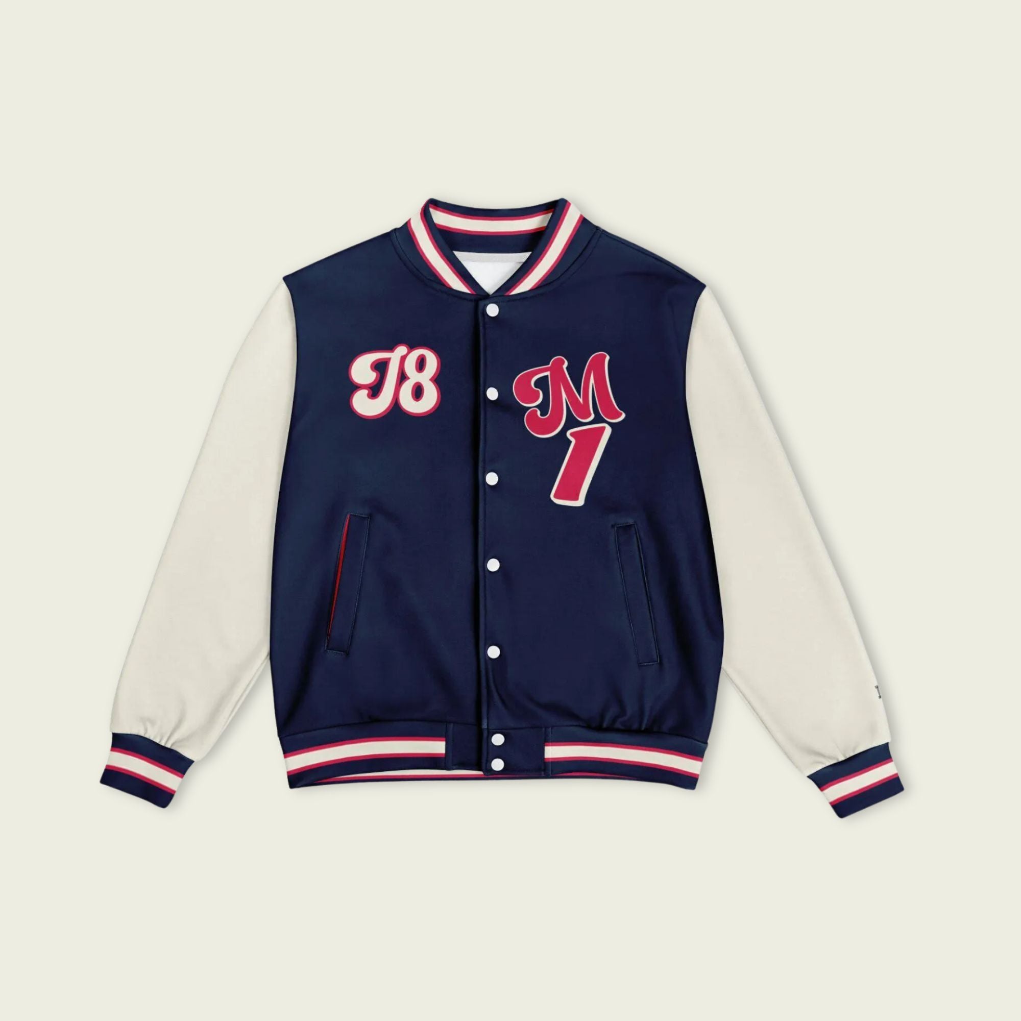 A navy blue, tan, and red varsity jacket with Max Verstappen Redbull F1 racing number in red on the front and back.