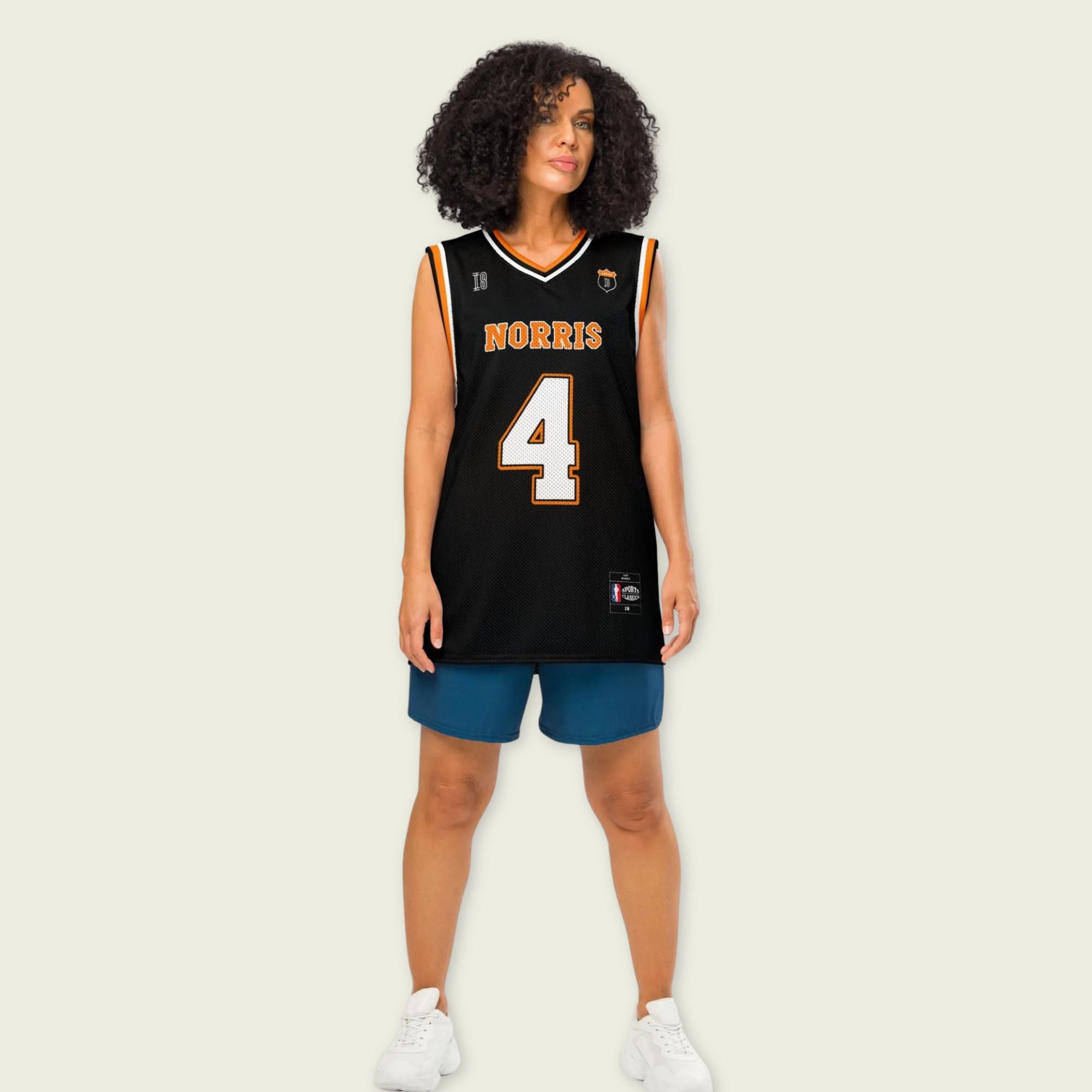 A black and papaya orange basketball Jersey with Lando Norris's McLaren F1 racing number 4 in orange and white on the front and back.