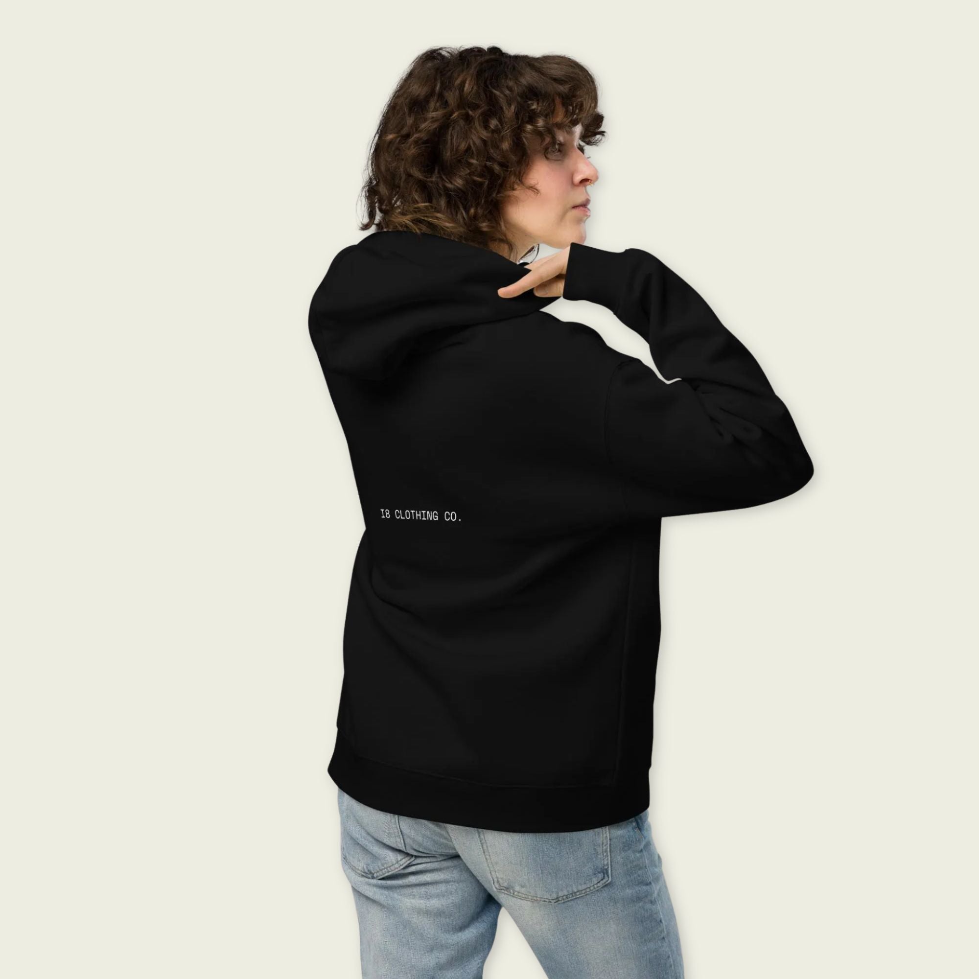 A black oversized hoodie with white text Lando on the front and lando norris's neon green helmut on the front.