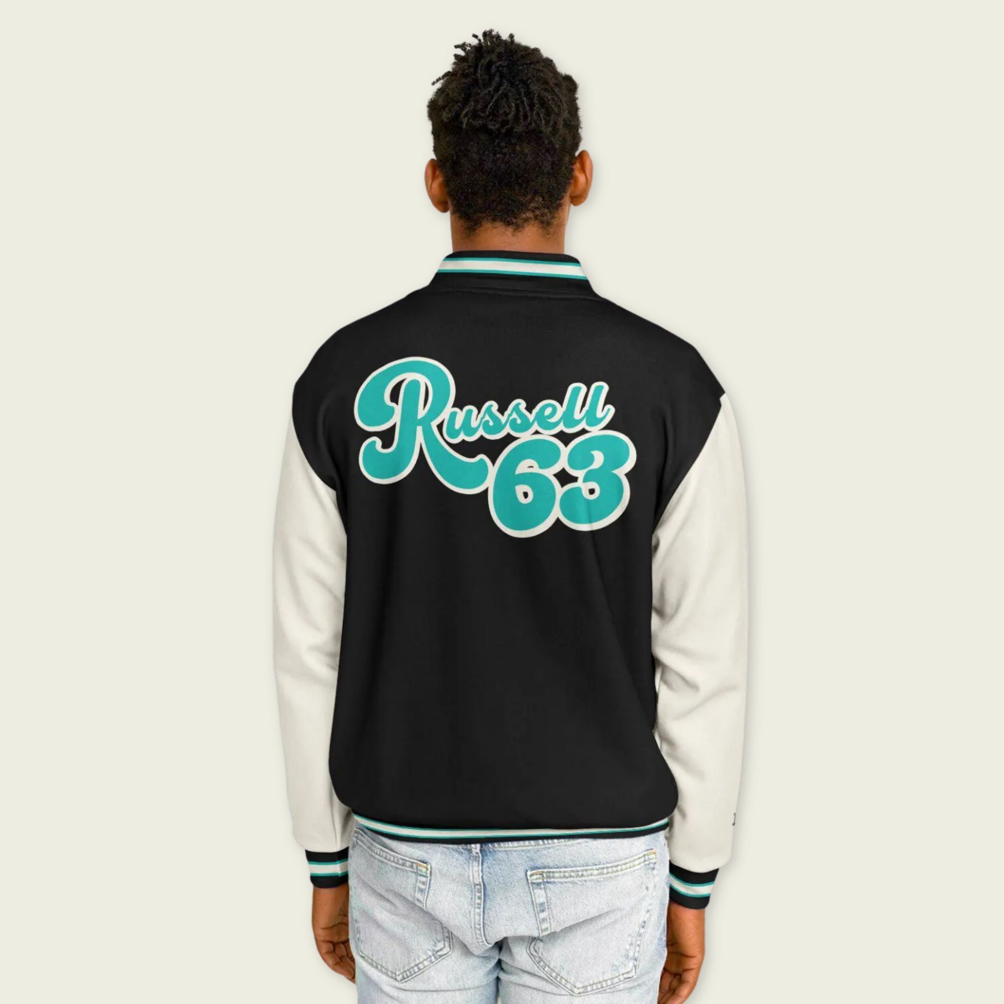 A navy petronas green, black, and tan, varsity jacket with George Russll's Mercedes F1 racing number 63 in green on the front and back.