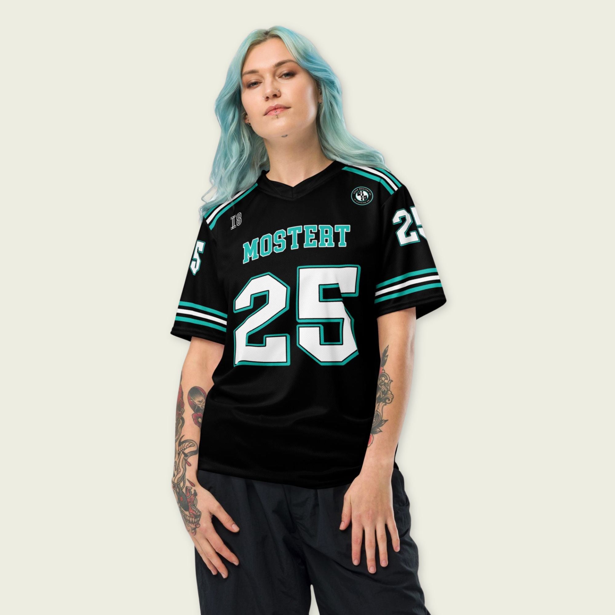 Person wearing a black sports jersey with 'MOSTERT' and number '25' on a plain background