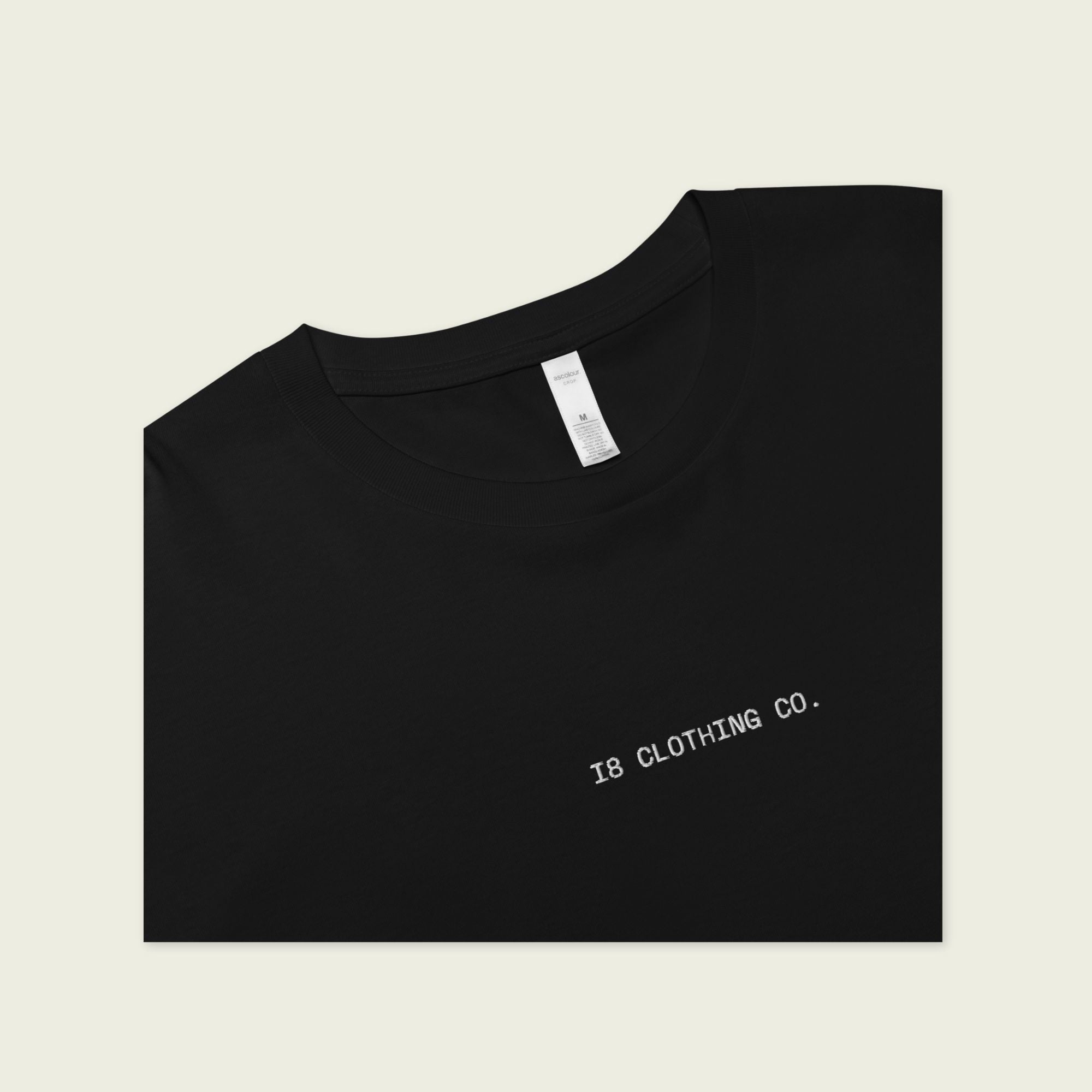 Black t-shirt with 'IB CLOTHING CO.' text on a beige background