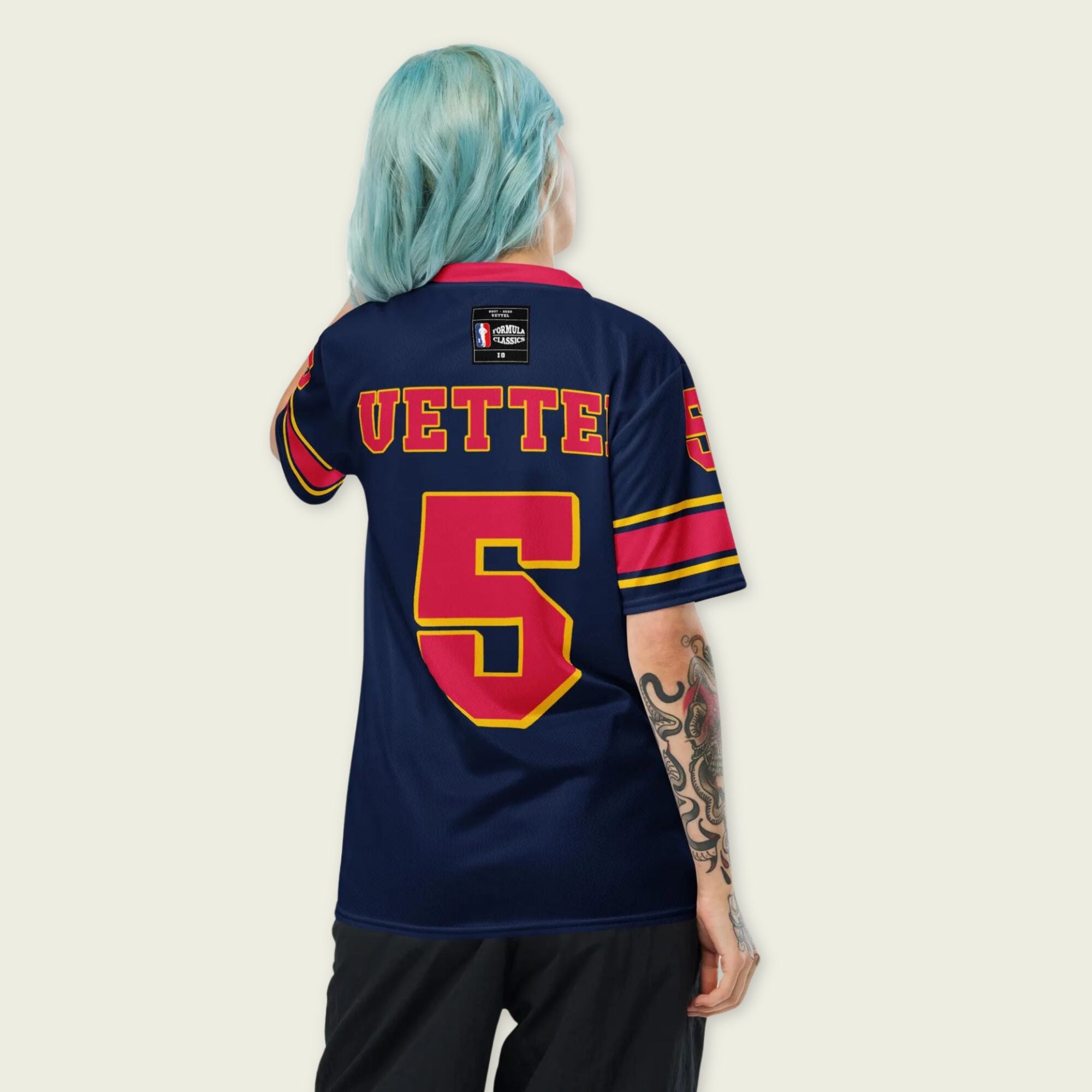 A navy blue football jersey with sebastian vetel redbull  F1 Racing number 5 on the front and back.