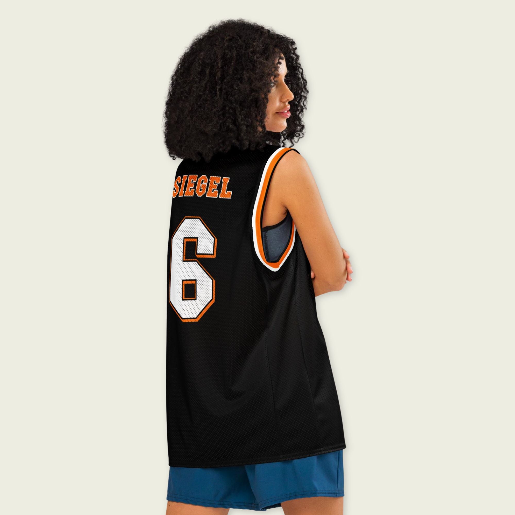 Person wearing a black basketball jersey with 'SIEGEL' and the number '6' on a plain background