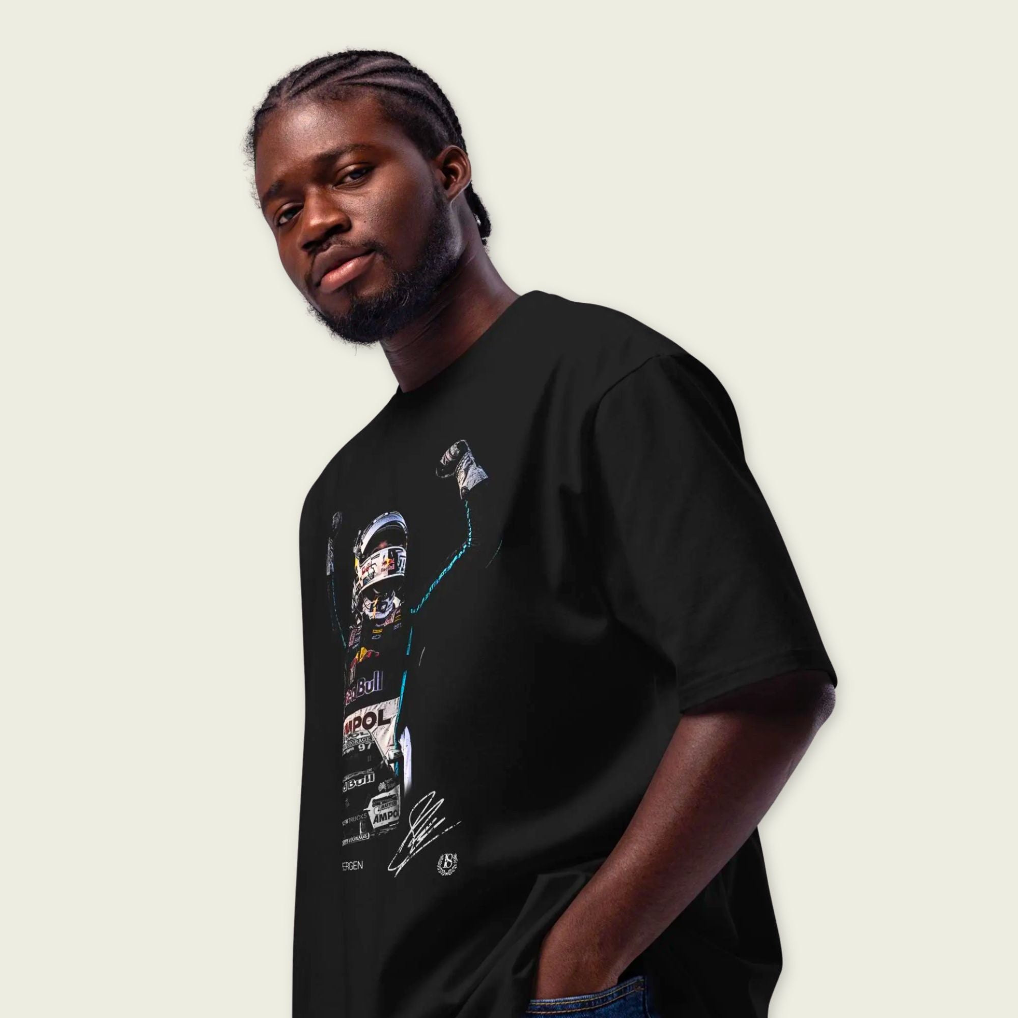 Man wearing a black t-shirt with graphic design on a plain background