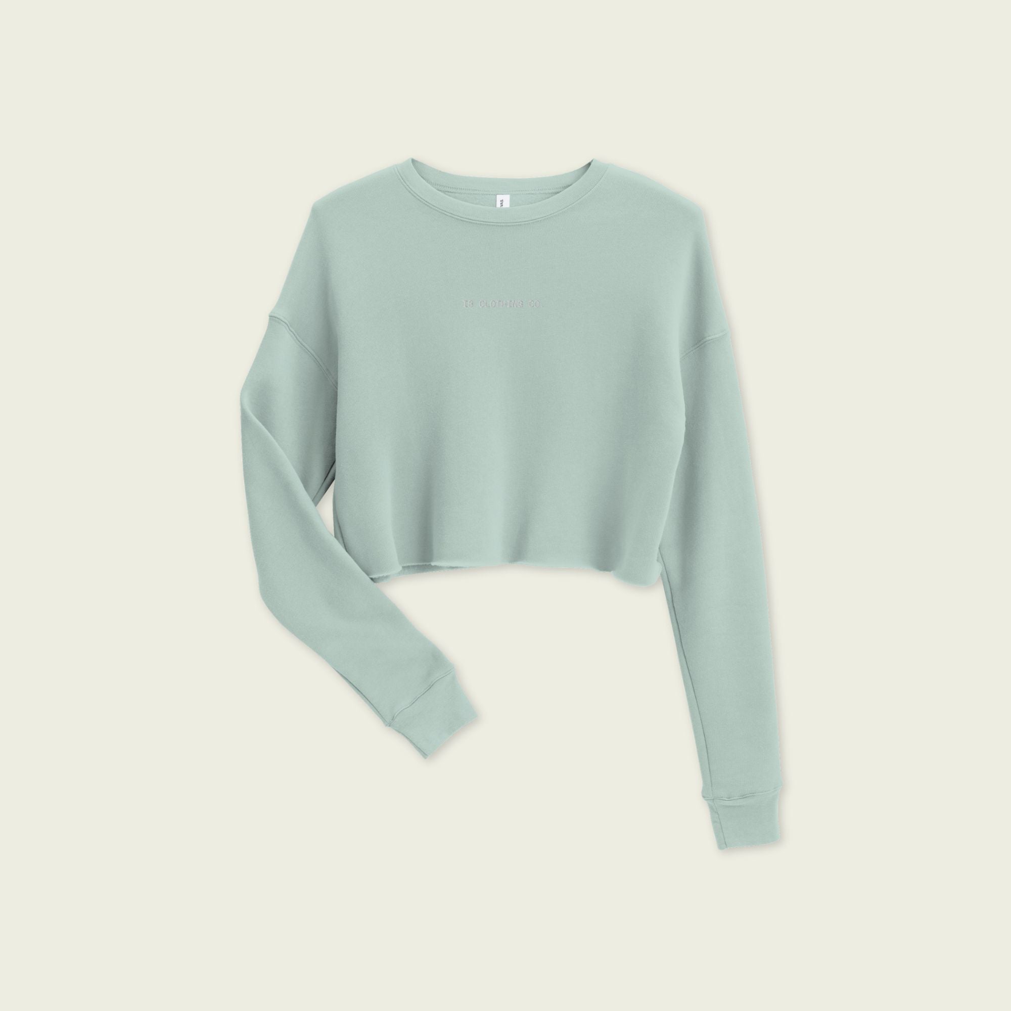 Light blue sweater on a beige background