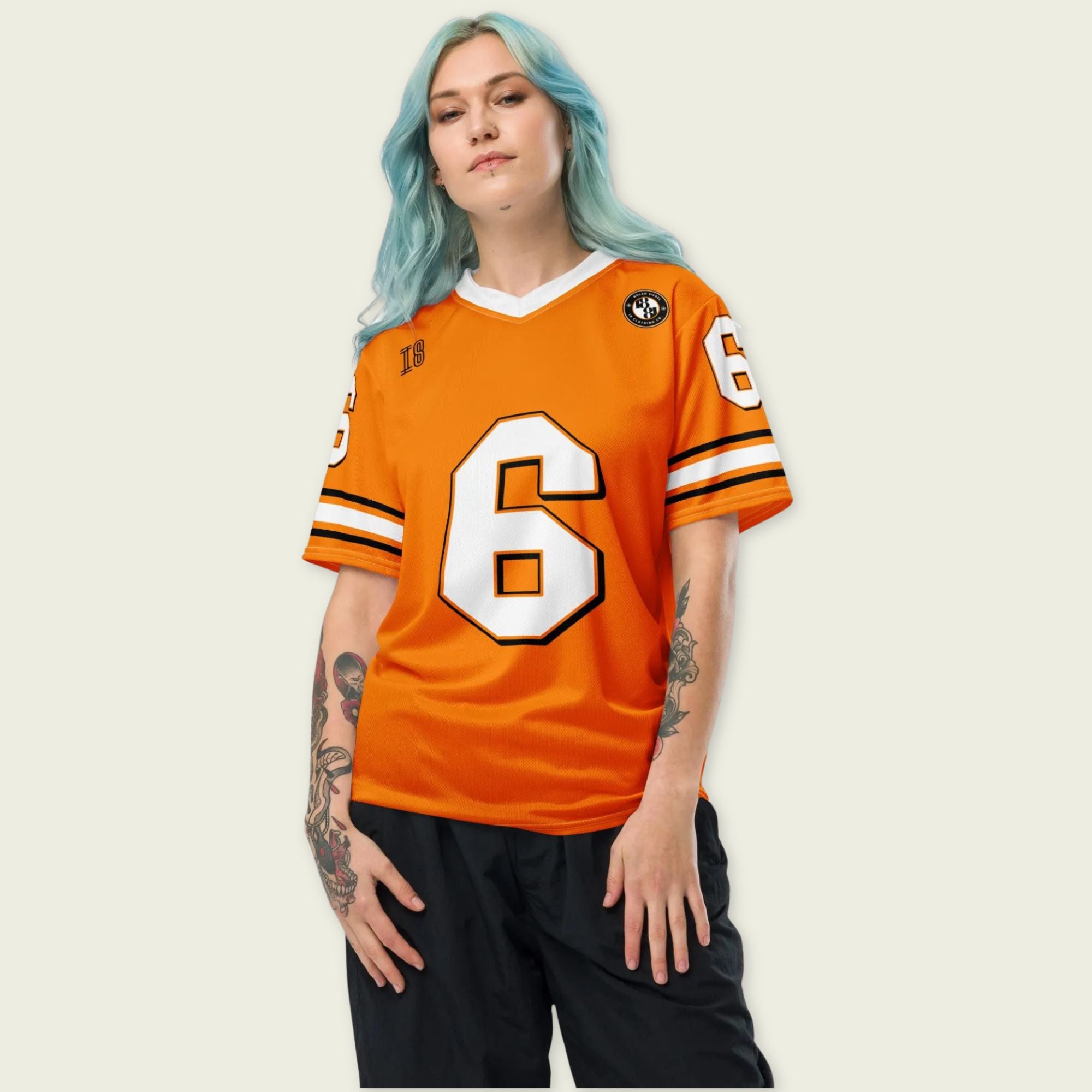 Person wearing an orange sports jersey with number 6 on a plain background