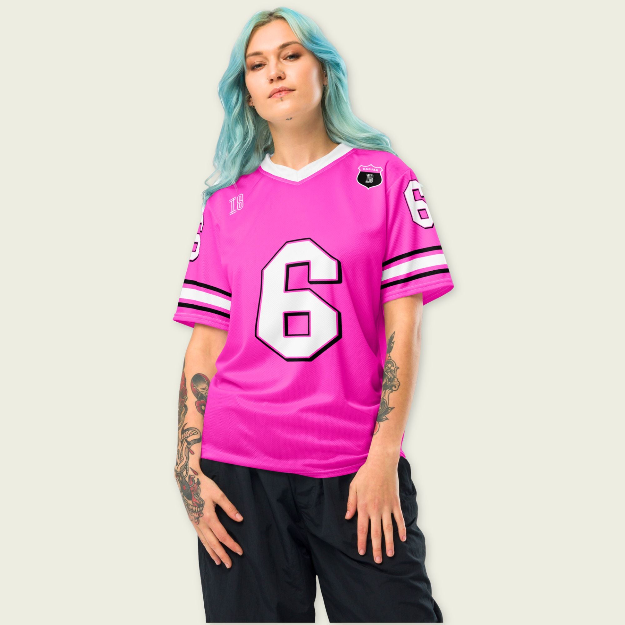 Person wearing a pink sports jersey with number 6 on a plain background
