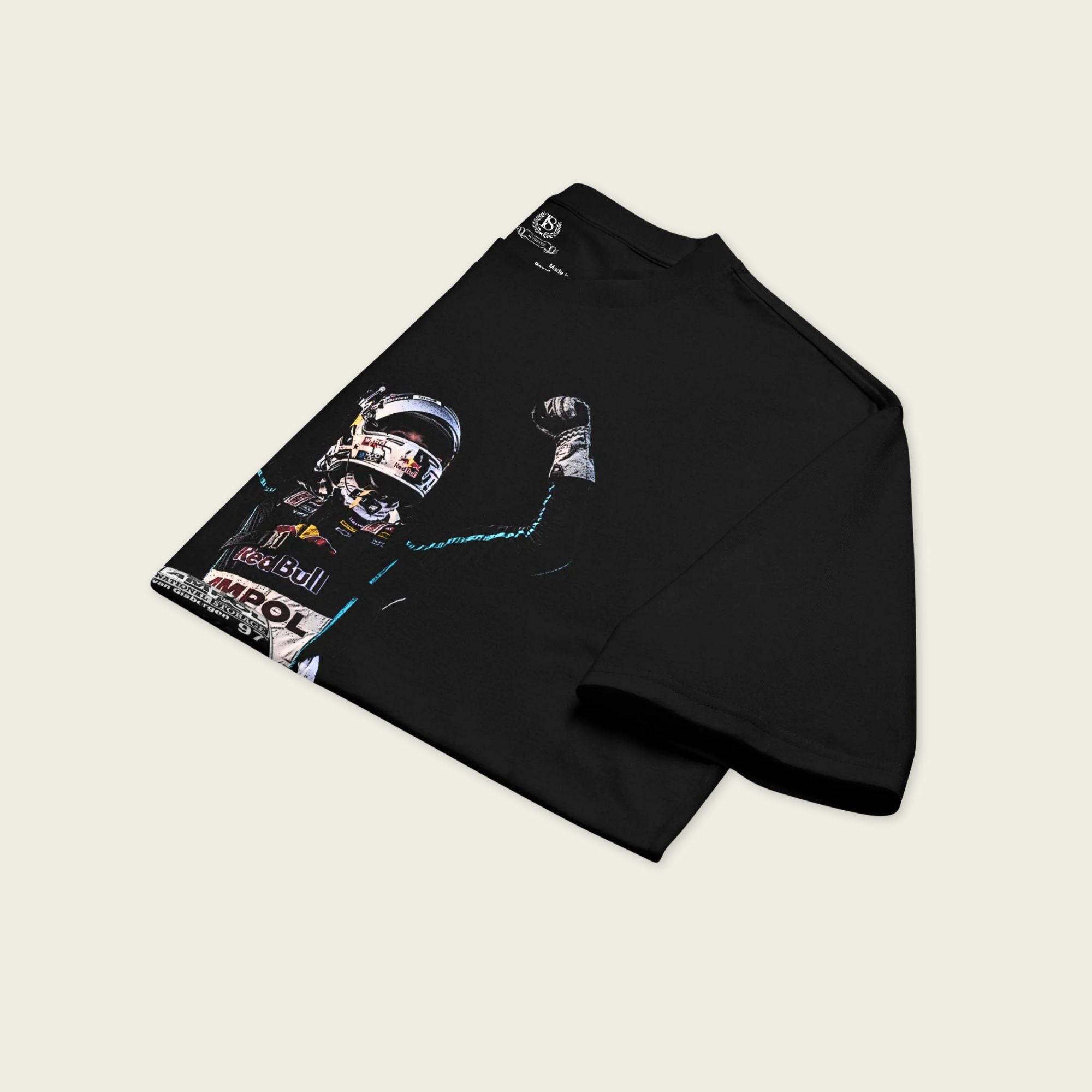Black long-sleeve shirt with graphic design on a light beige background