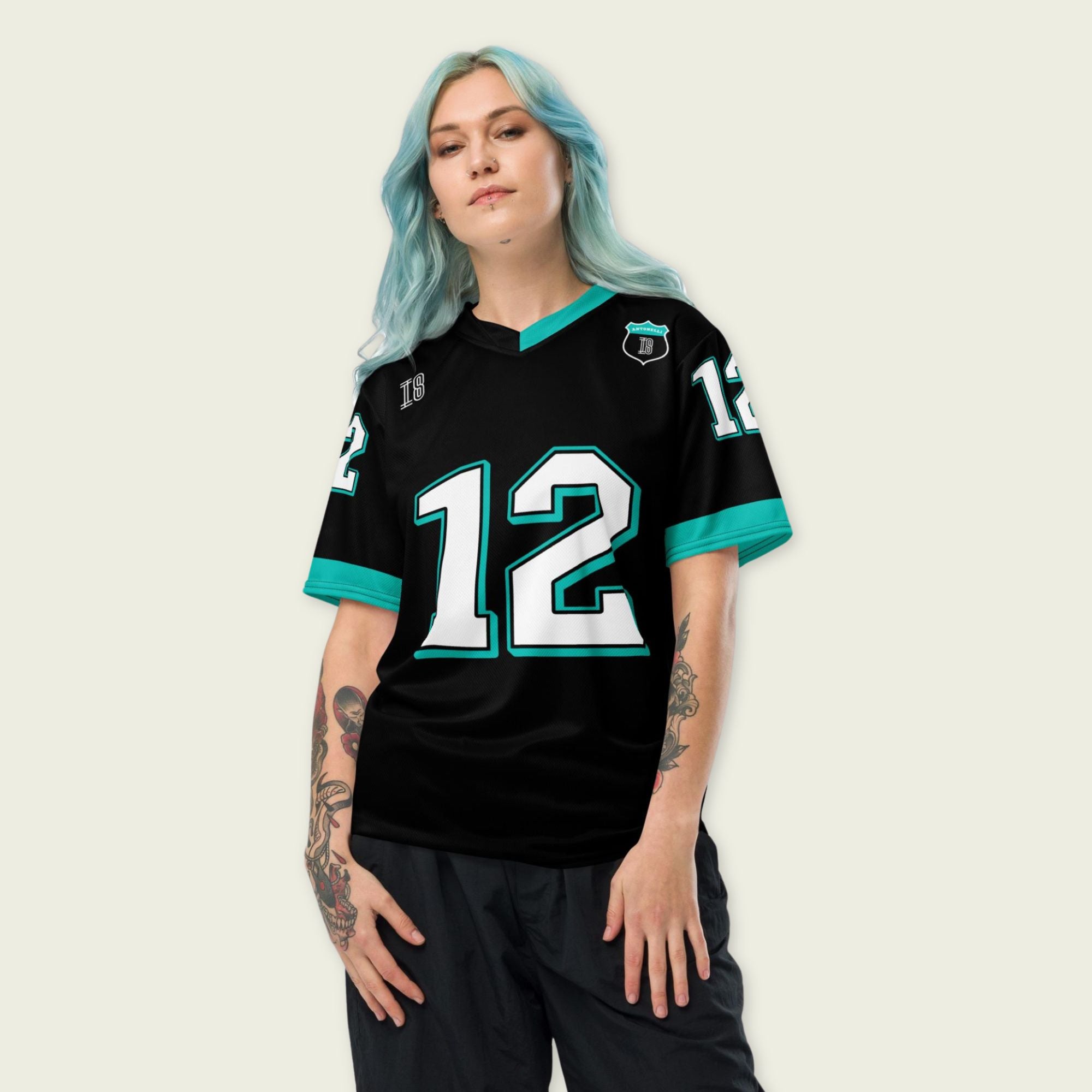 A black and AMG Green football jersey with Andrea Kimi Antonelli's Mercedes F1 racing number 12 on the back and front in white. It has the name Antonelli in green on the front and back as well.