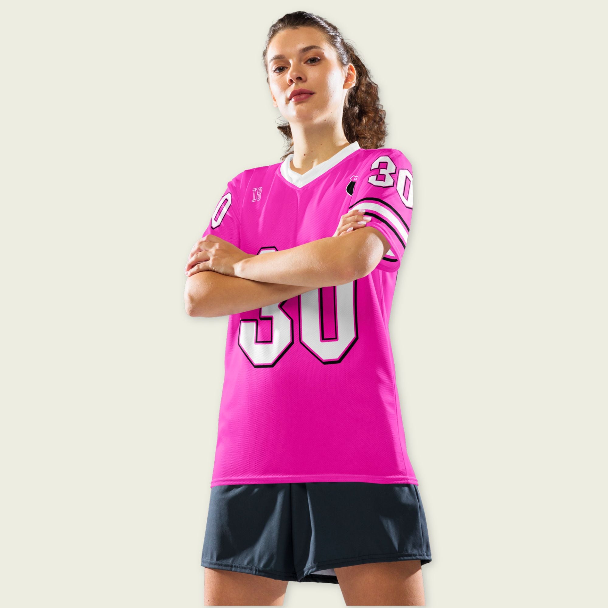 Person wearing a pink sports jersey with number 30 on a plain background