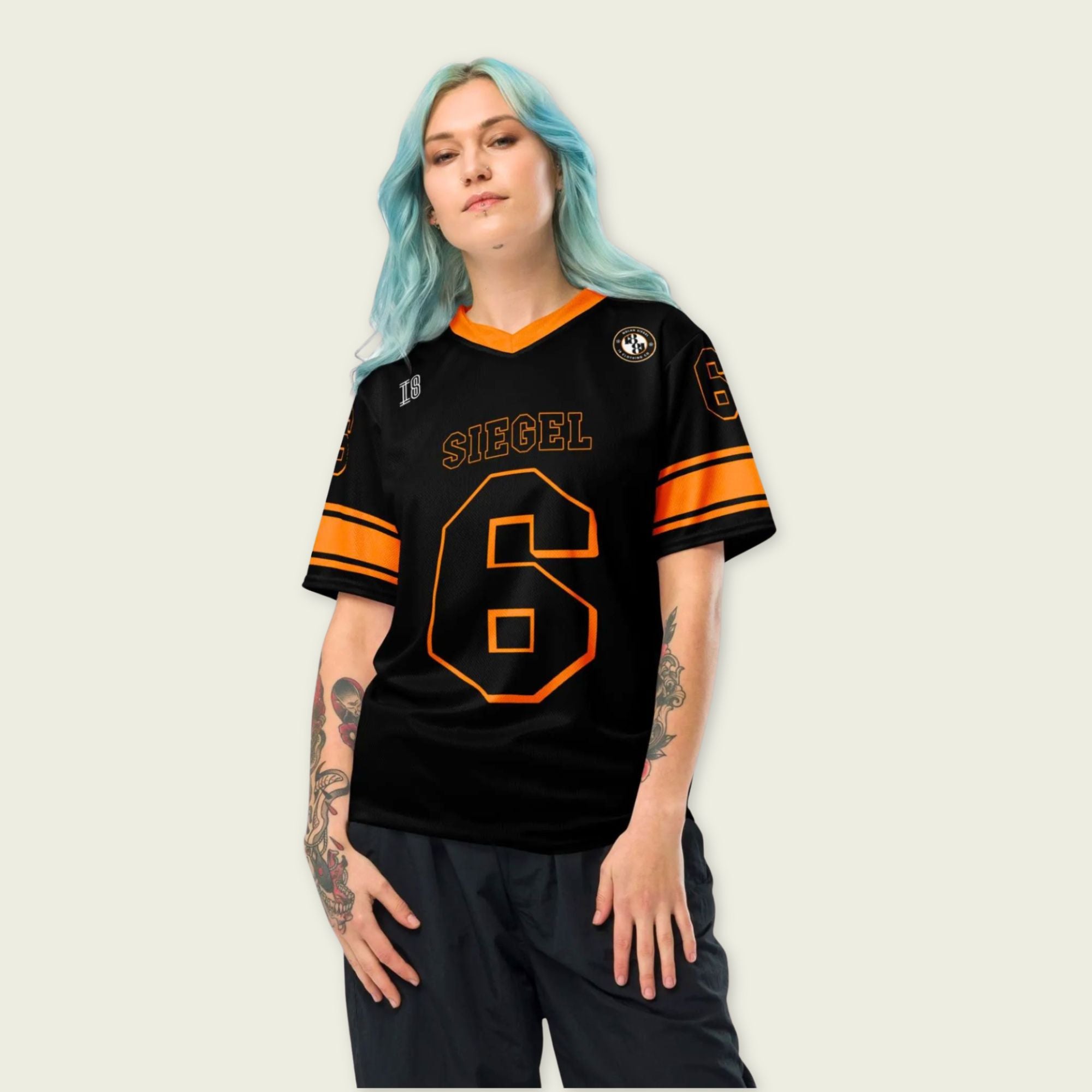 Person wearing a black sports jersey with orange accents and 'SIEGEL' and number '6' on a plain background