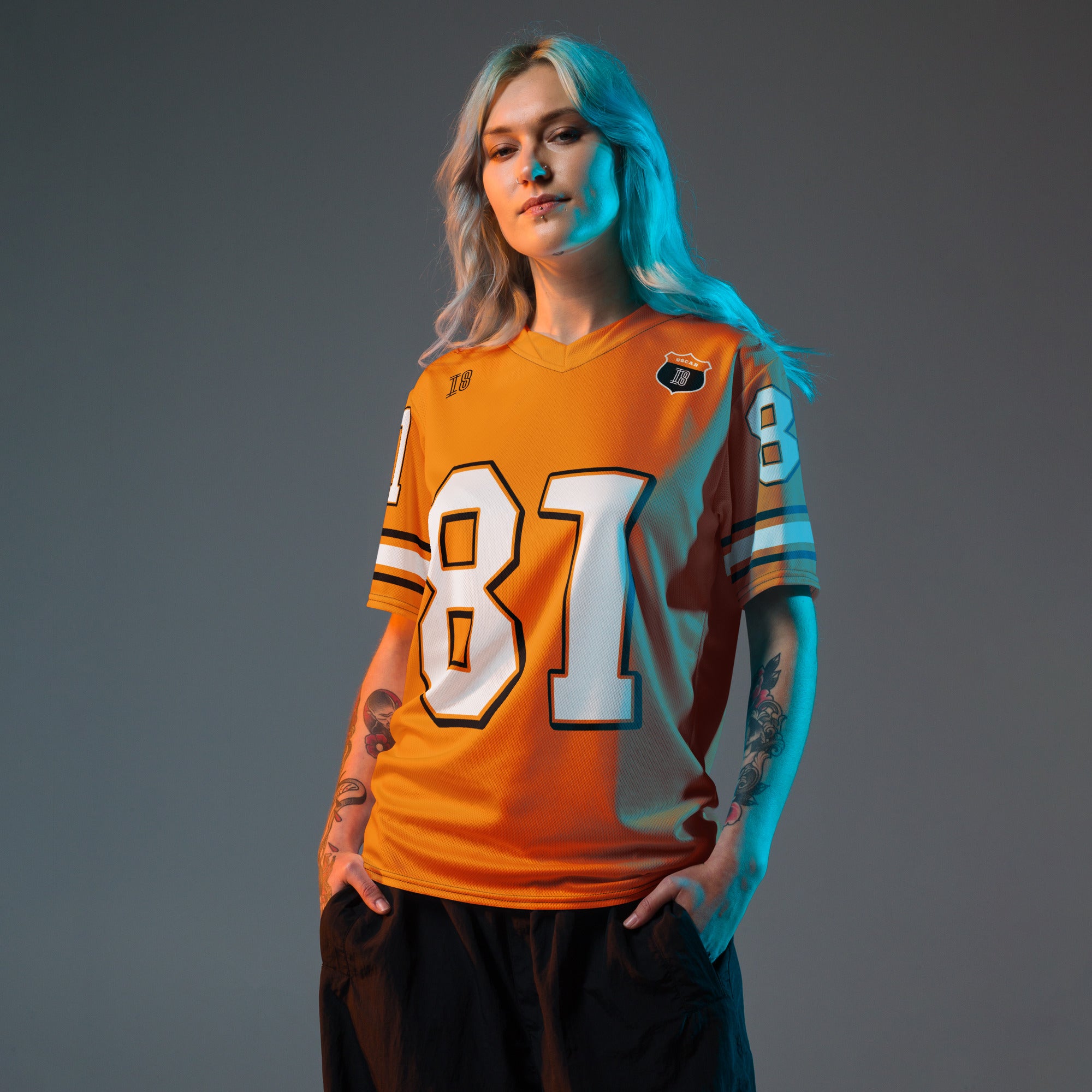 A papaya orange football jersey with Oscar Piastris McLaren  F1 Racing number 81 on the front and back.