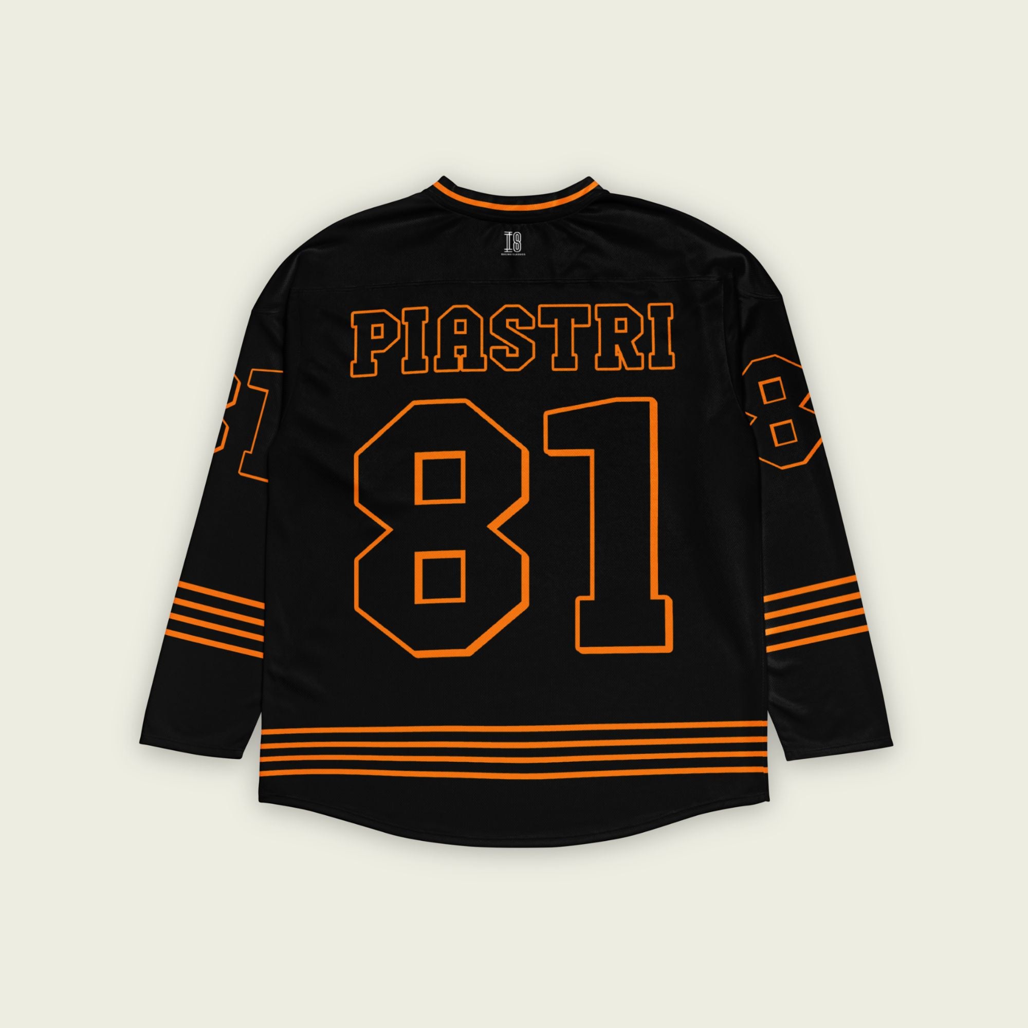 A black ands papaya orange hockey jersey with Oscar Piastri's McLaren F1 racing number 83 in Orange on the front and back. It has the name Piastri the back and front in Orange as well