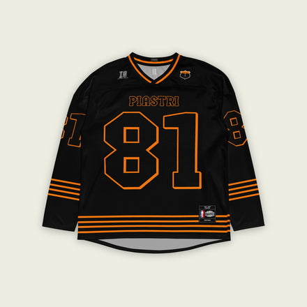 A black ands papaya orange hockey jersey with Oscar Piastri's McLaren F1 racing number 83 in Orange on the front and back. It has the name Piastri the back and front in Orange as well