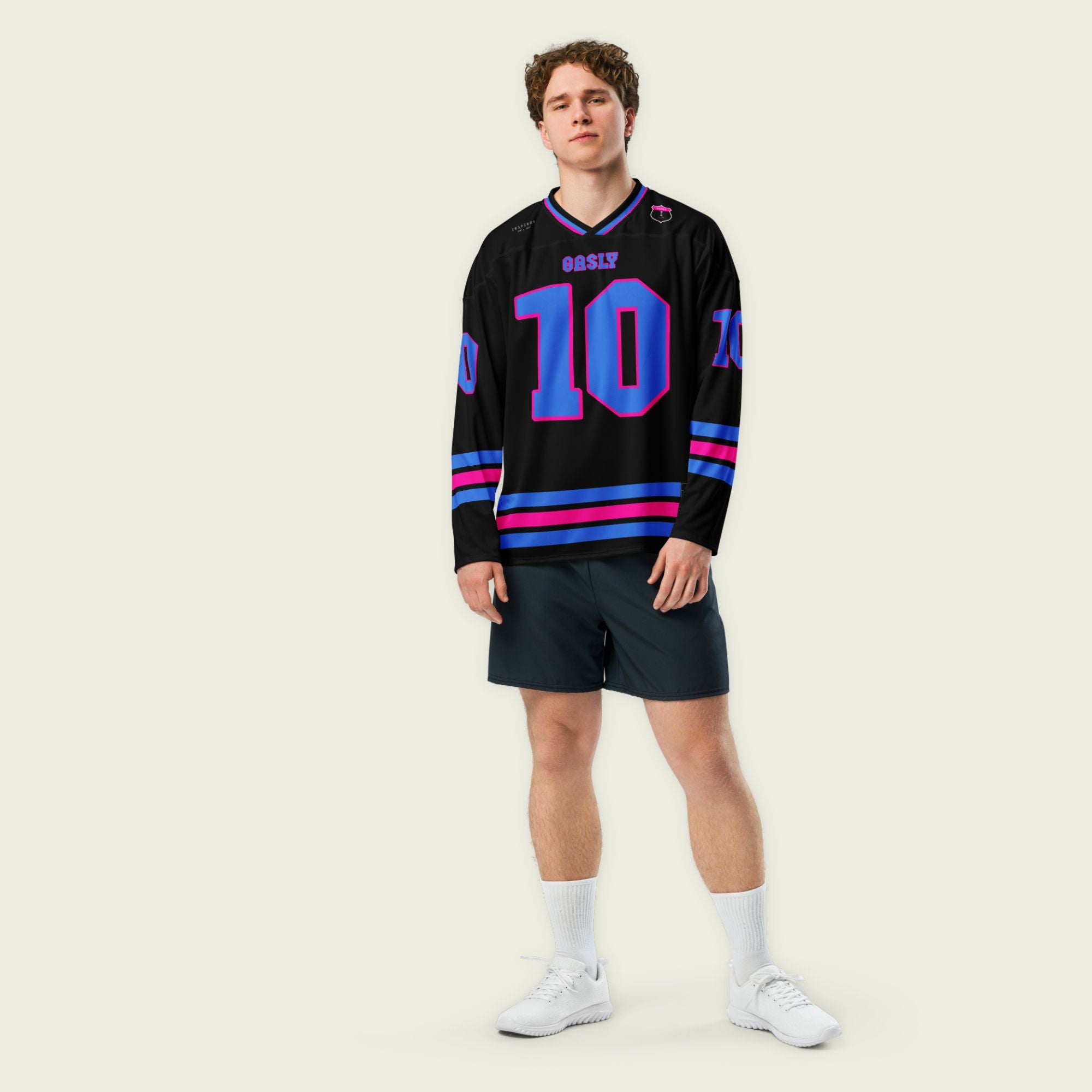A black hockey jersey with three lines 2 blue and the middle one pink at the bottom both on the front and back, also the arms. there is a blue number 10 that pierre gasly races in F1 on the front and back with a pink outline. and his name Gasly on the front and back