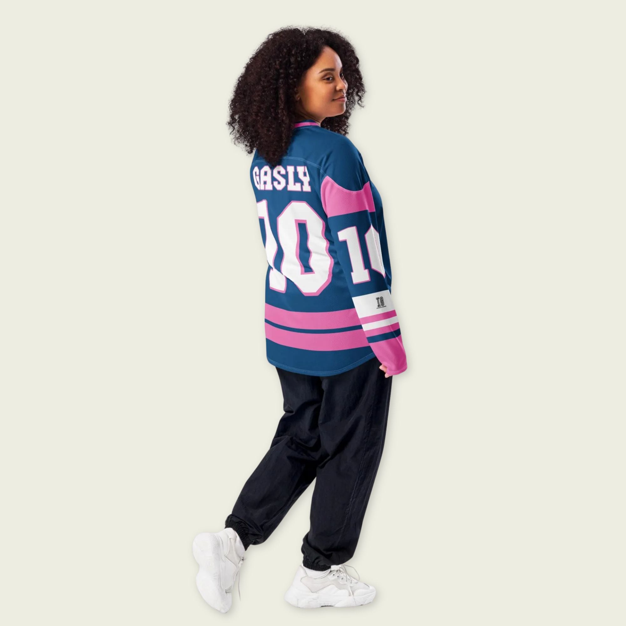 A blue, and pink hockey jersey with Pierre Gasly's F1 2025 Alpine racing number 10 on the front and back in white. The name Gasly in white is on the front and back.