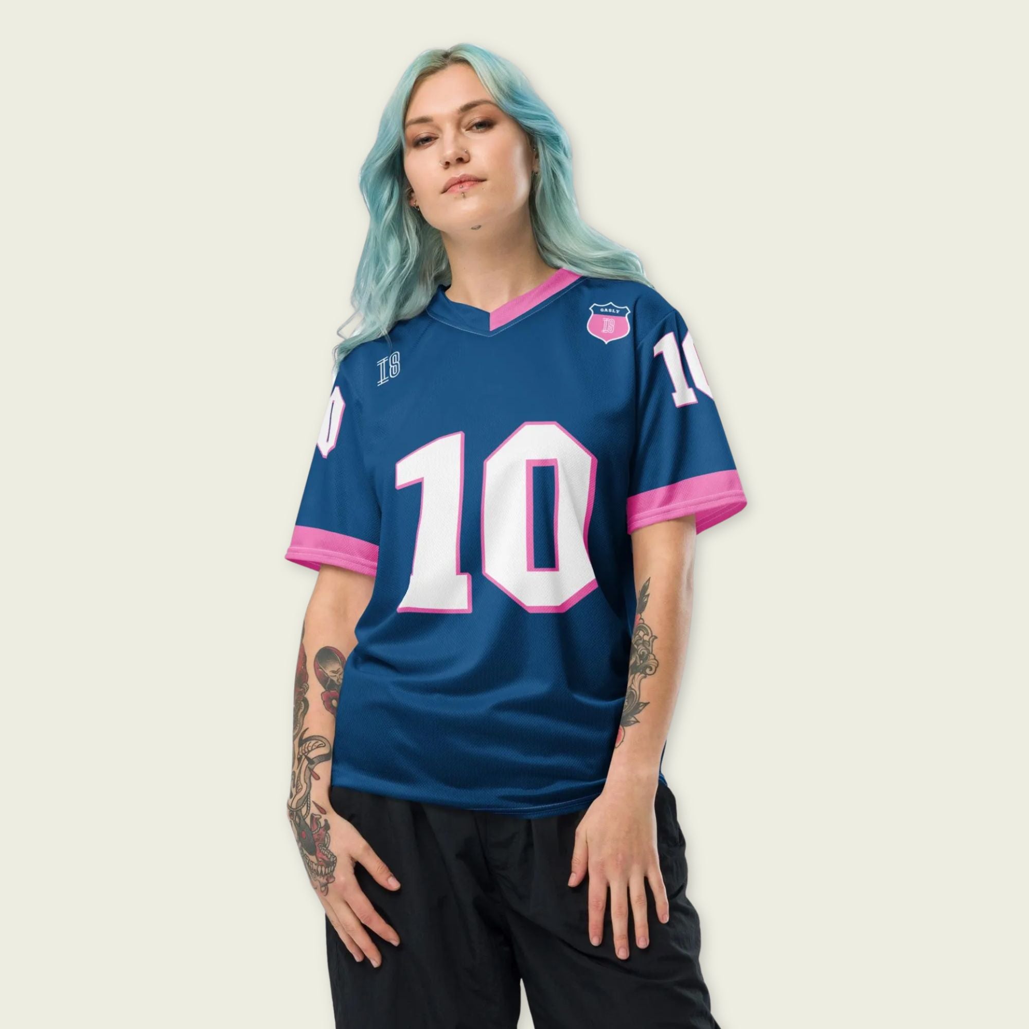 A blue and pink football jersey with Pierre Gasly' s Alpine F1 Racing number 10 on the front and back in white with a pink and black outline.