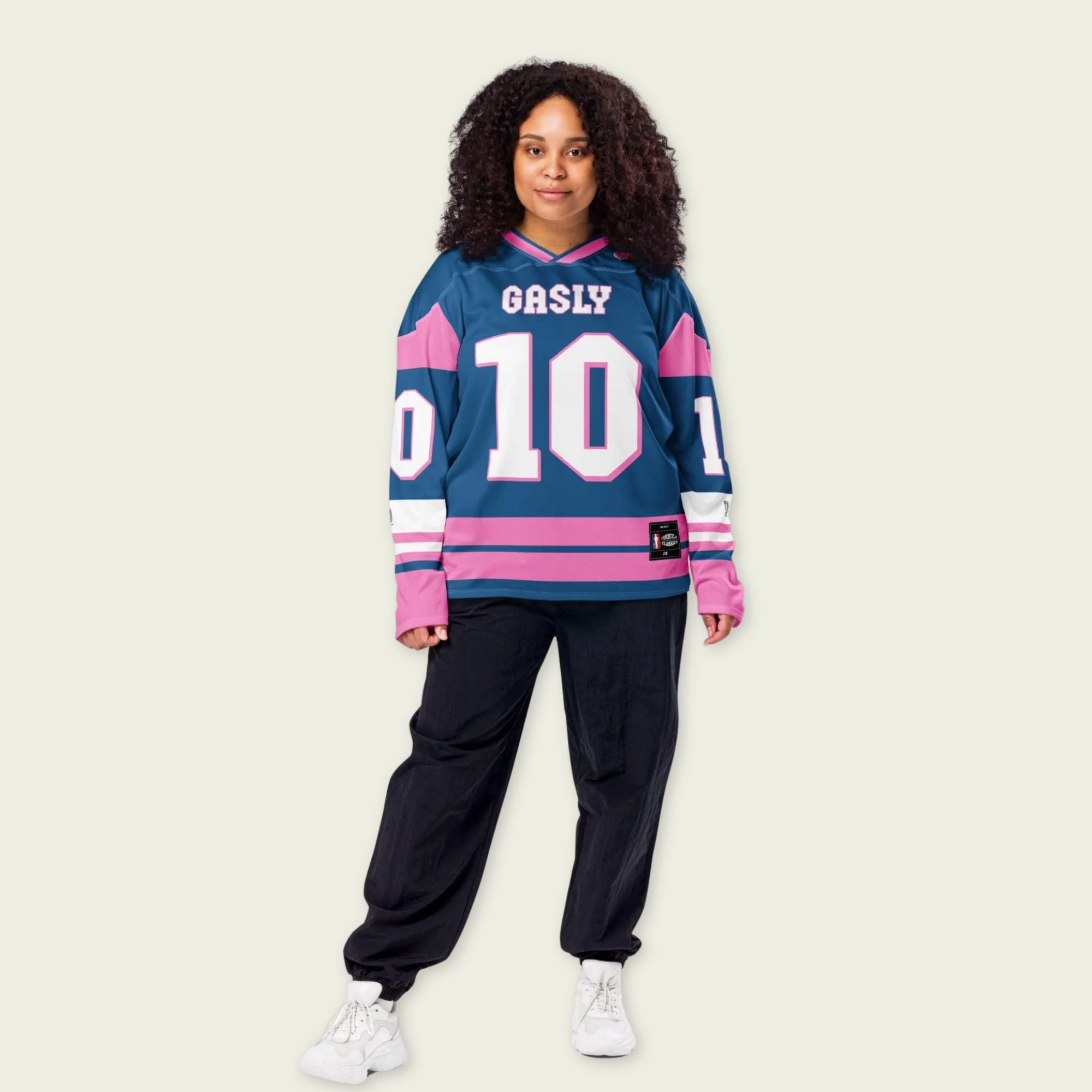 A blue, and pink hockey jersey with Pierre Gasly's F1 2025 Alpine racing number 10 on the front and back in white. The name Gasly in white is on the front and back.