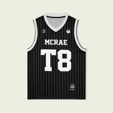 A black and white pin striped basketball Jersey with T8 Tate Mcrae on the front and back in white.