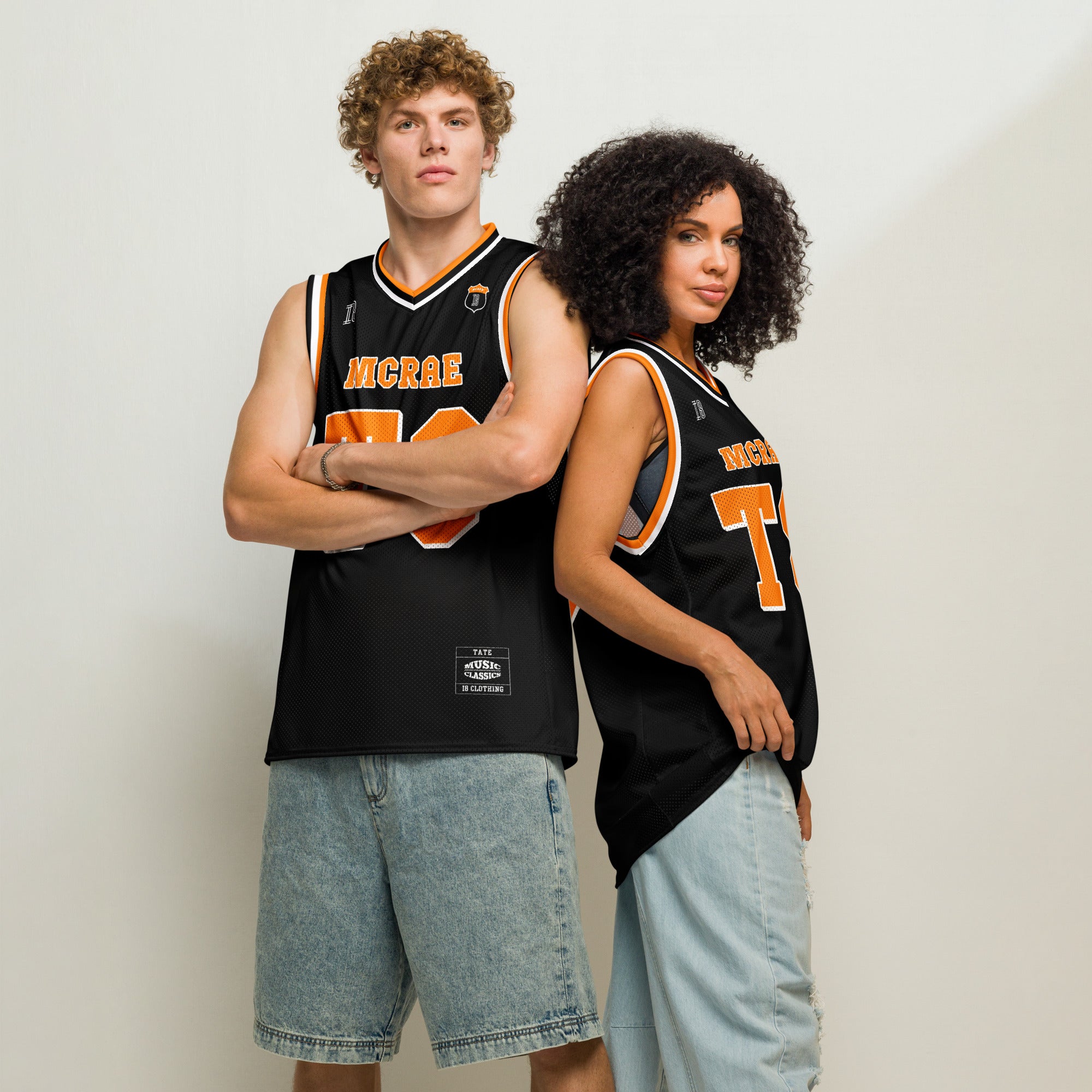 A black and orange pin striped basketball Jersey with T8 Tate Mcrae on the front and back in white.