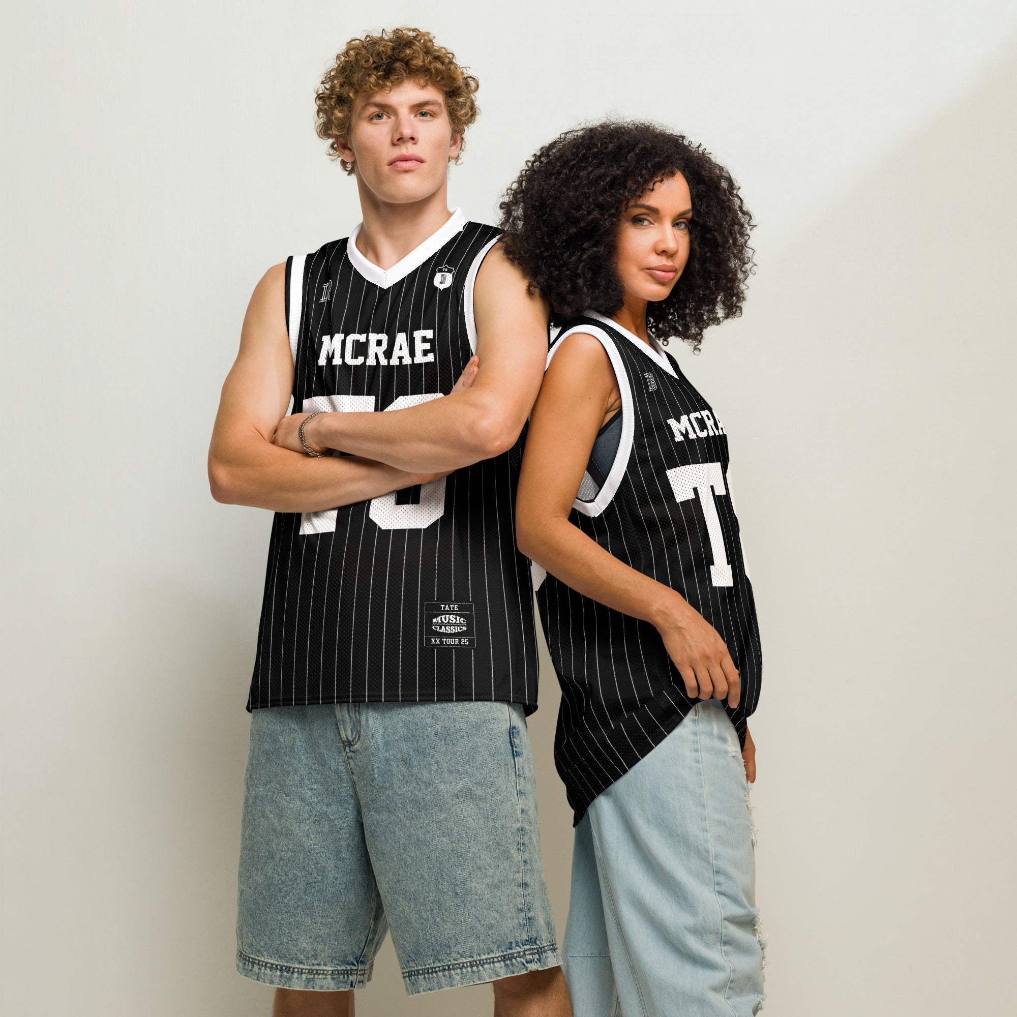 A black and white pin striped basketball Jersey with T8 Tate Mcrae on the front and back in white.