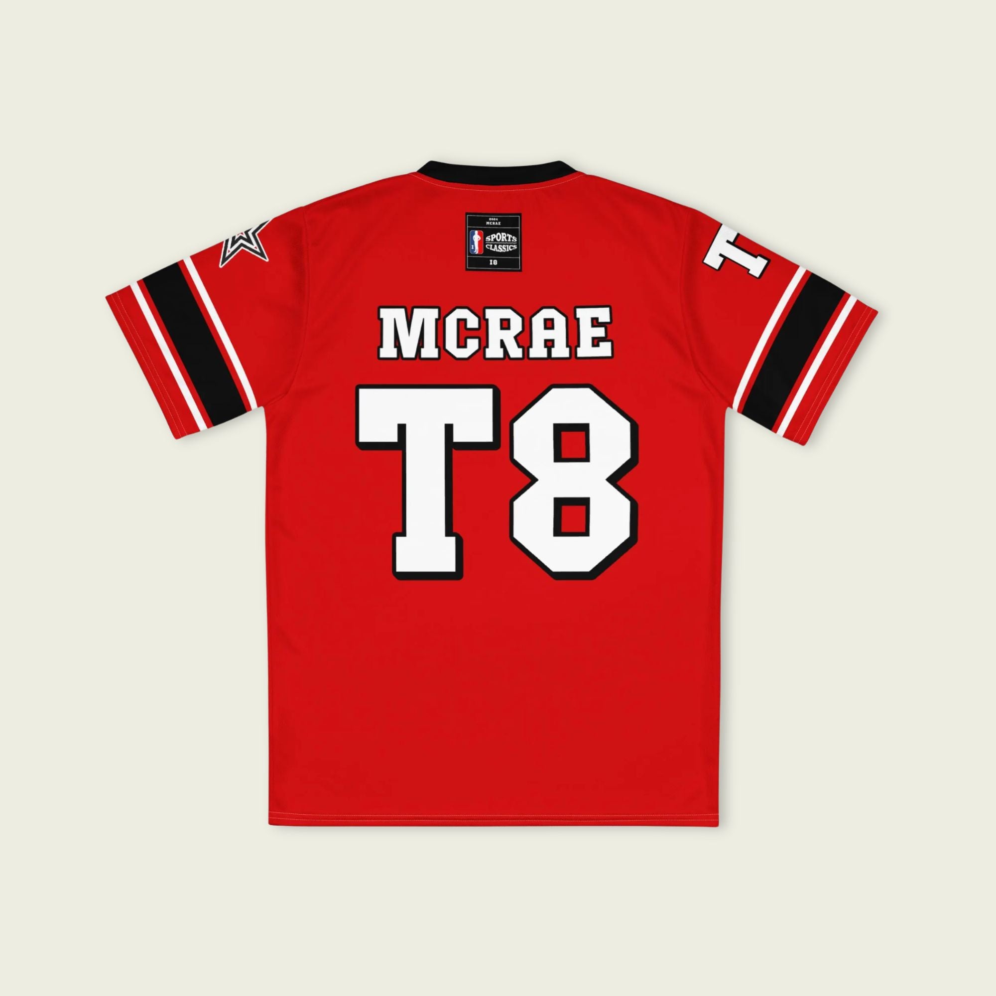 A red, black, and white football jersey with Tate Mcare on the back and front in white with a white outline.