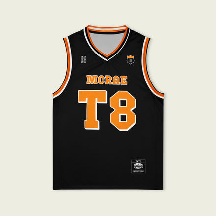 A black and orange pin striped basketball Jersey with T8 Tate Mcrae on the front and back in white.