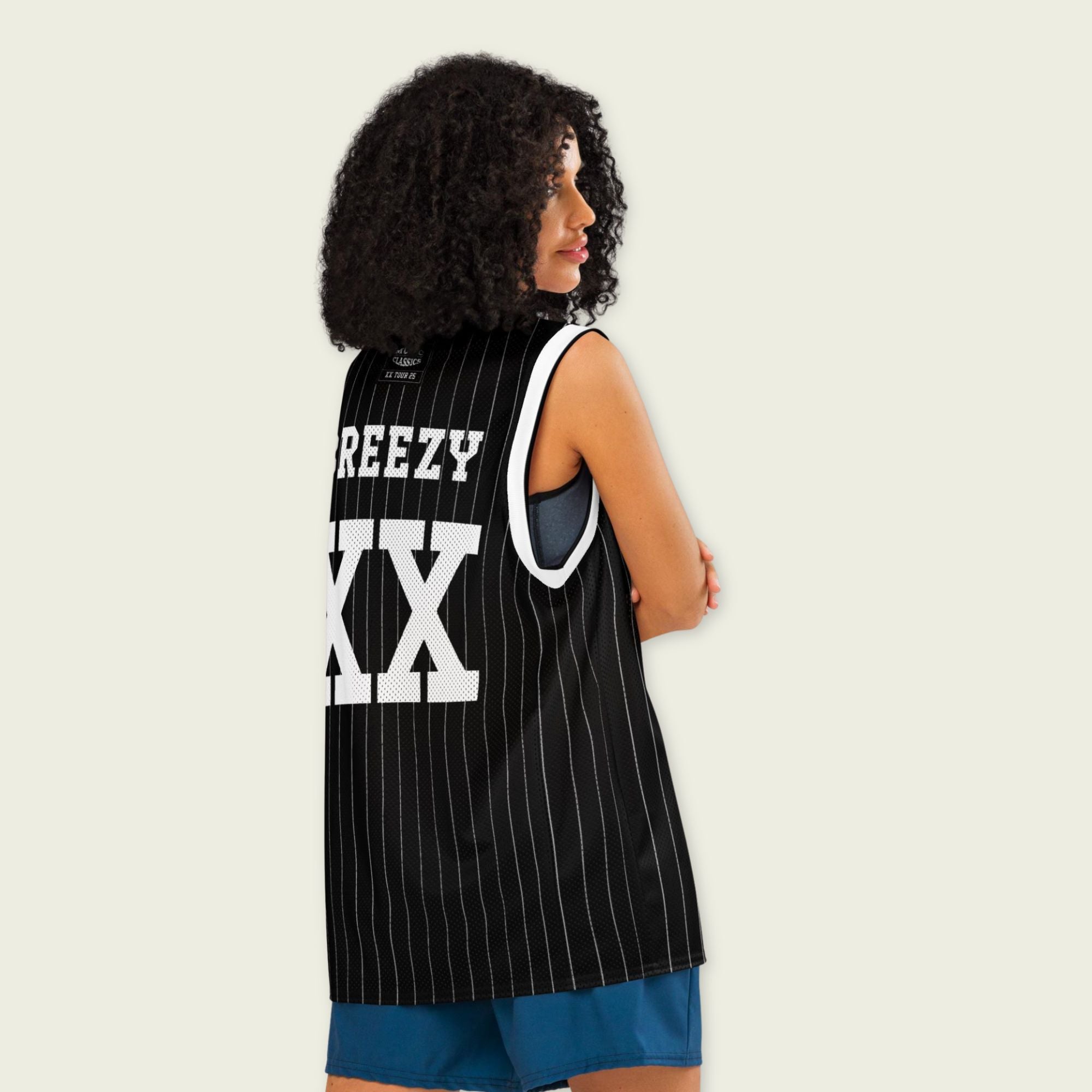 A black and white pin striped basketball Jersey with Chris Brown's Breezy name on the front and back and XX for his 11-11 tour in white, both on the front and back.