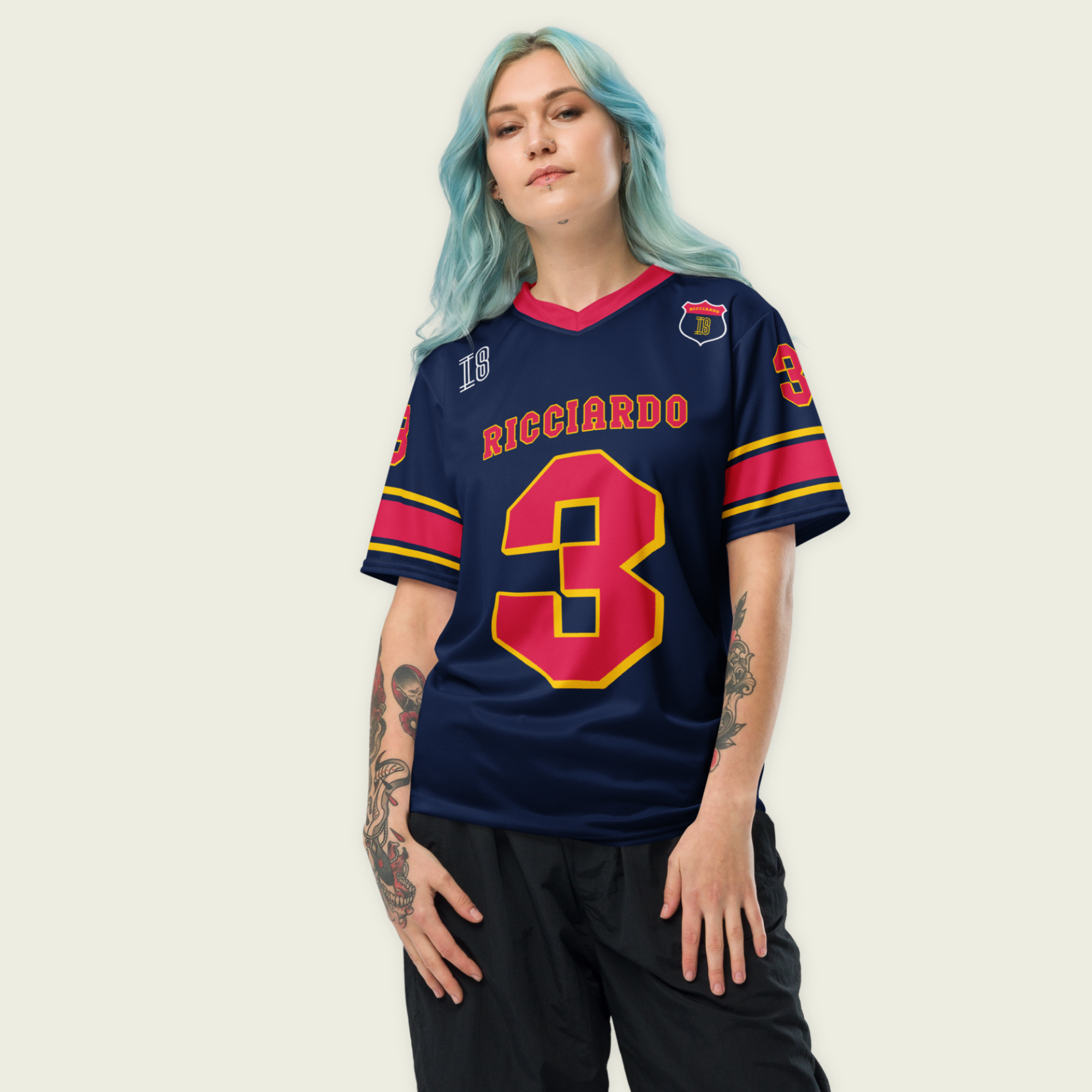 A navy blue and red football jersey with Daniel Ricciardo's Redbull F1 racing number in red on the front and back.