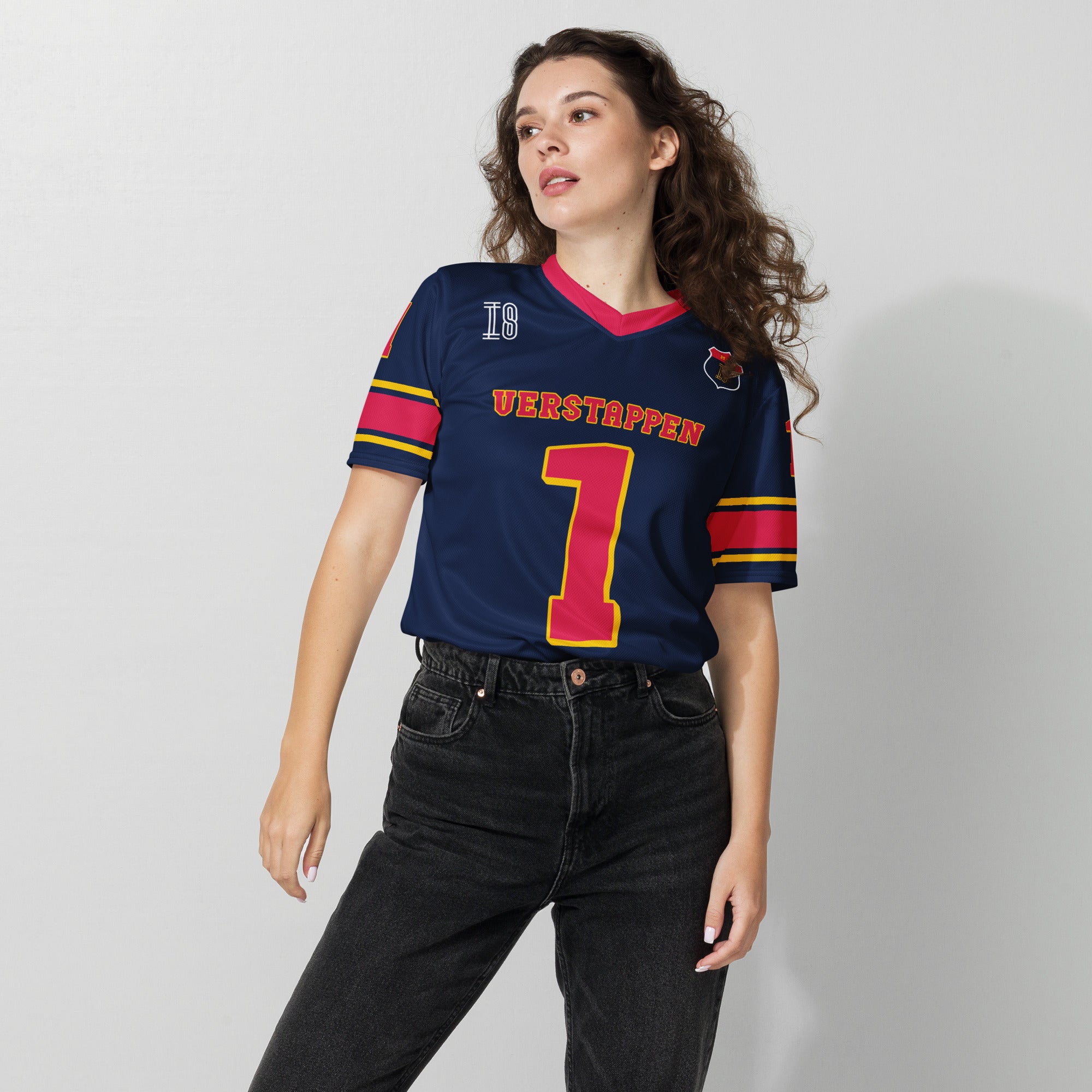 A navy blue and red football jersey with  Max Verstappen's Redbull F1 racing number 1 on the front and back.