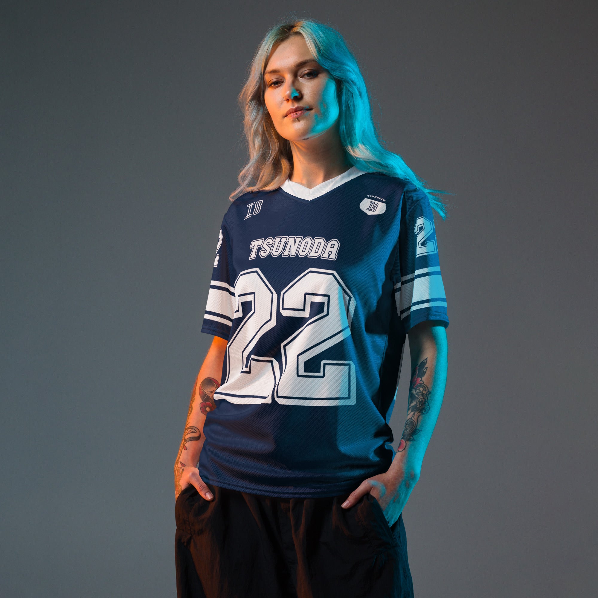 A navy blue and white football jersey it has Yuki Tsunoda's VCARB f1 racing number 22 on the front and back in white.