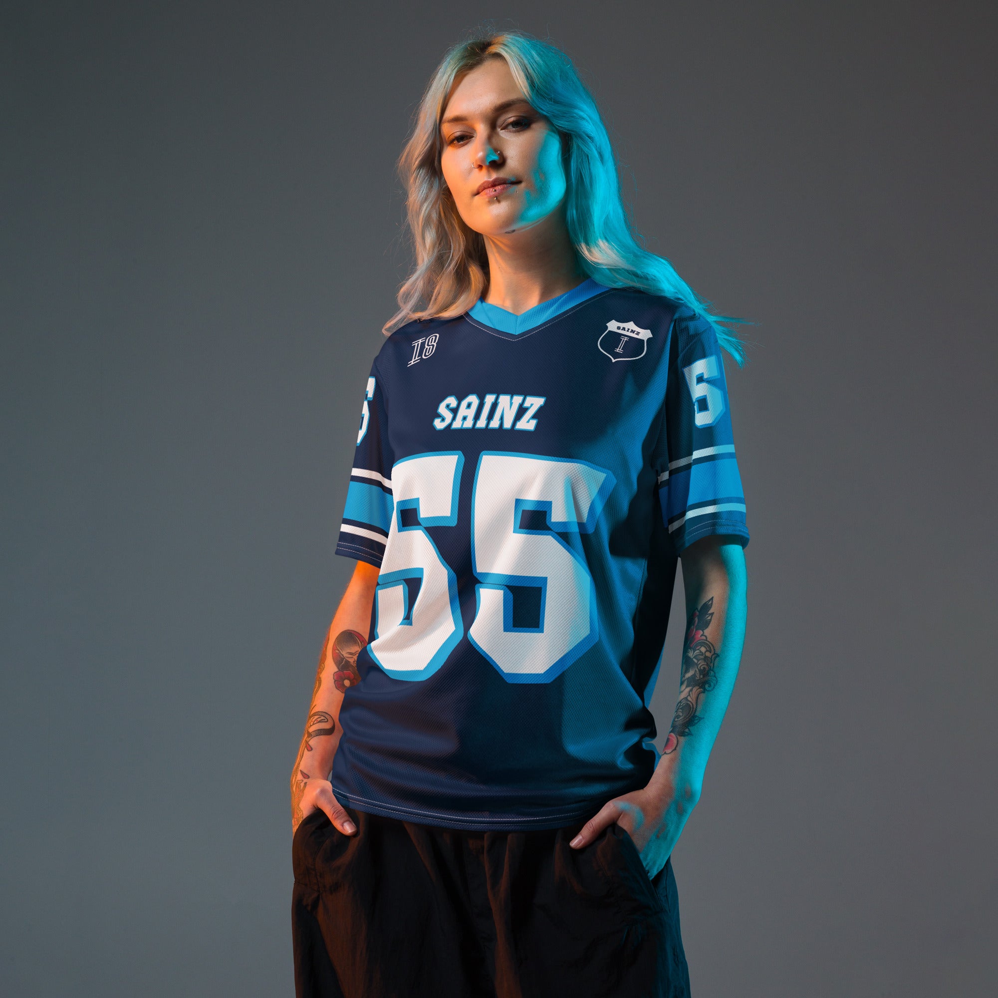 A navy blue football jersey with Carlos Sainz Jnr's WIlliams F1 racing number 55 on the back and front in white with a light blue outline.