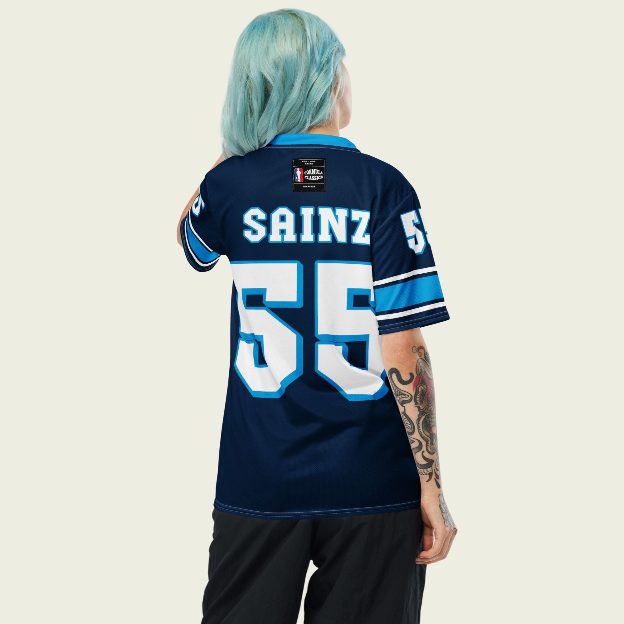 A navy blue football jersey with Carlos Sainz Jnr's WIlliams F1 racing number 55 on the back and front in white with a light blue outline.