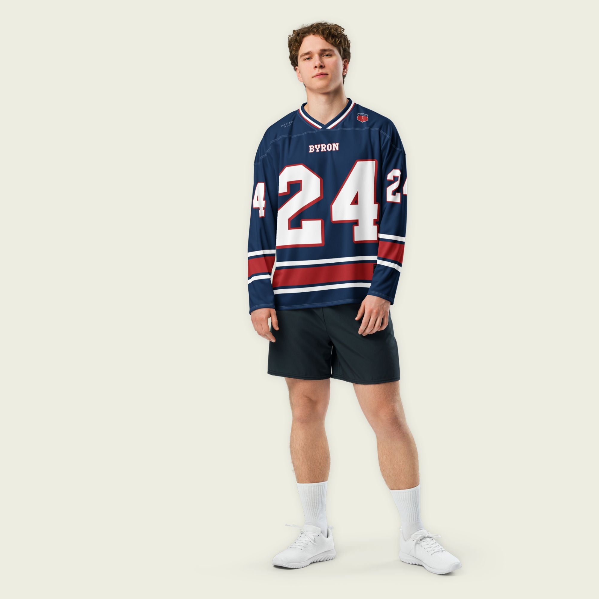 A navy, white, and red hockey jersey with William Byron's Nascar number 24 displayed