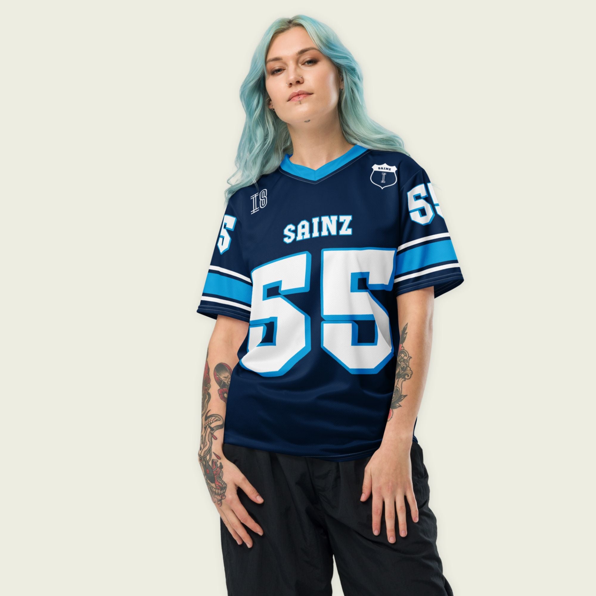 A navy blue football jersey with Carlos Sainz Jnr's WIlliams F1 racing number 55 on the back and front in white with a light blue outline.