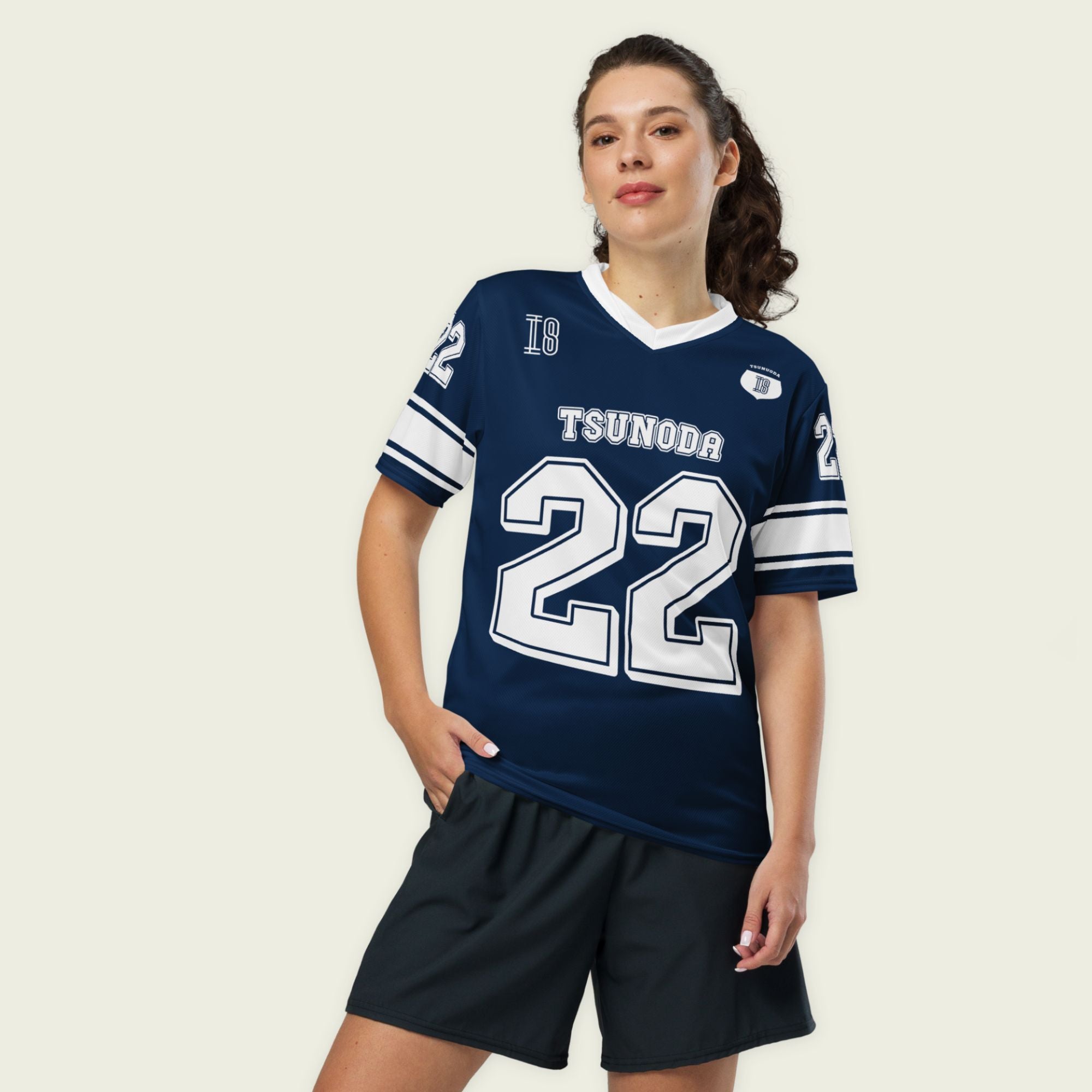 A navy blue and white football jersey it has Yuki Tsunoda's VCARB f1 racing number 22 on the front and back in white.