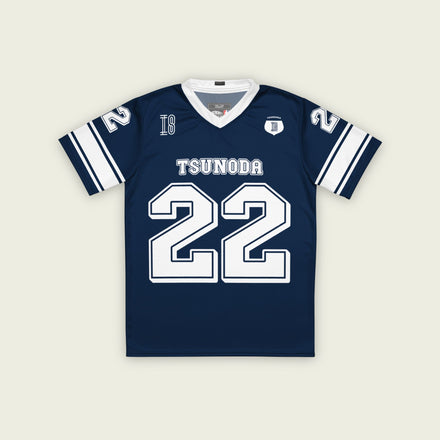 A navy blue and white football jersey it has Yuki Tsunoda's VCARB f1 racing number 22 on the front and back in white.