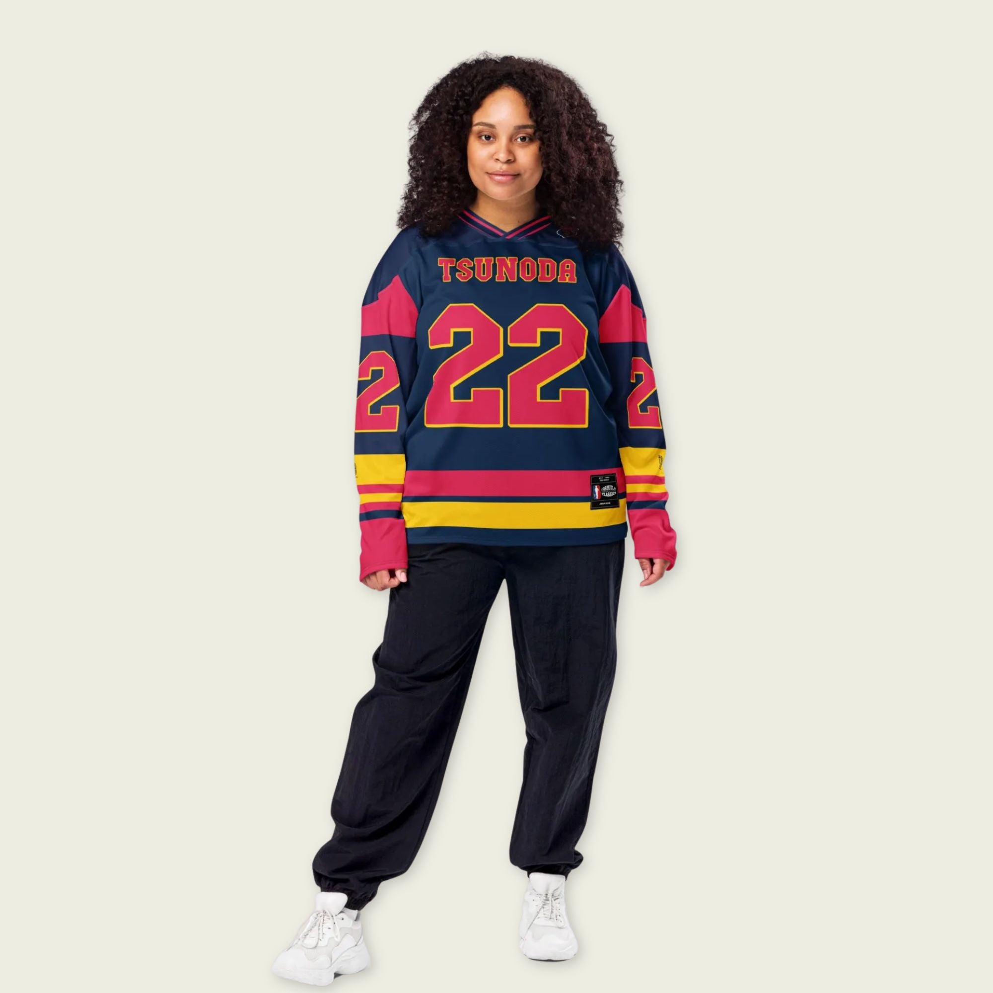 A navy blue hockey jersey with Yuki Tsunoda redbull F1 racing number 22. It has the name Tsunoda on the back and front.