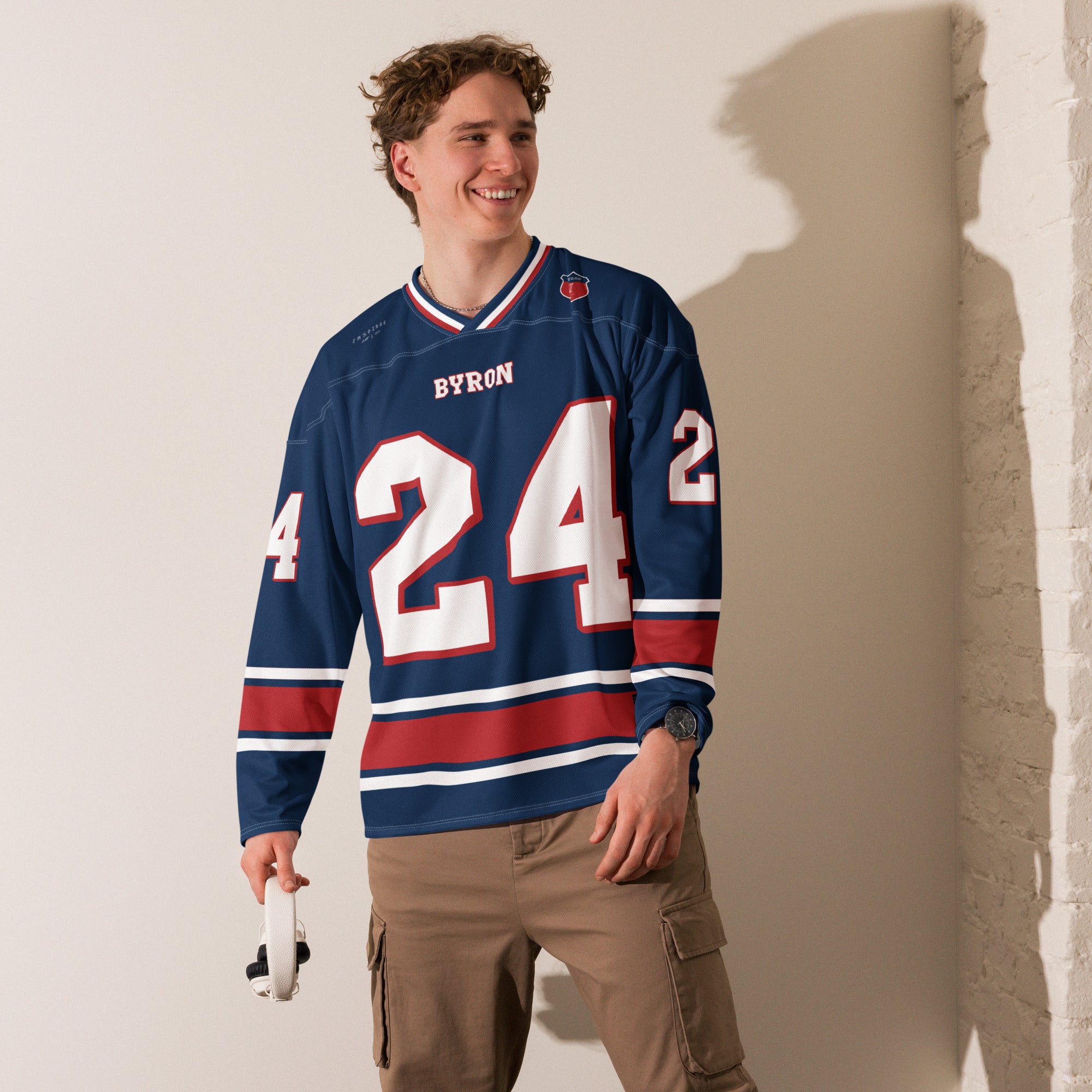 A navy, white, and red hockey jersey with William Byron's Nascar number 24 displayed