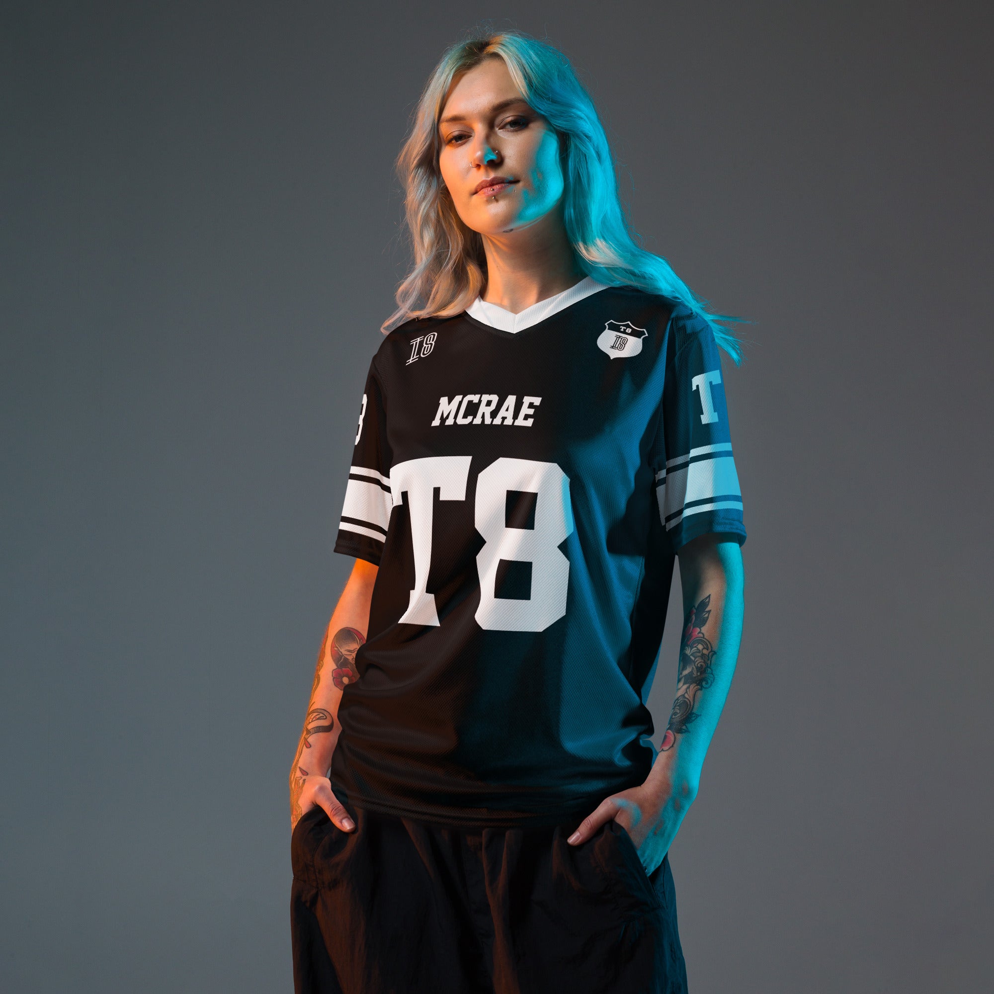 A black and white football jersey with Tate Mcare on the back and front in white with a white outline.