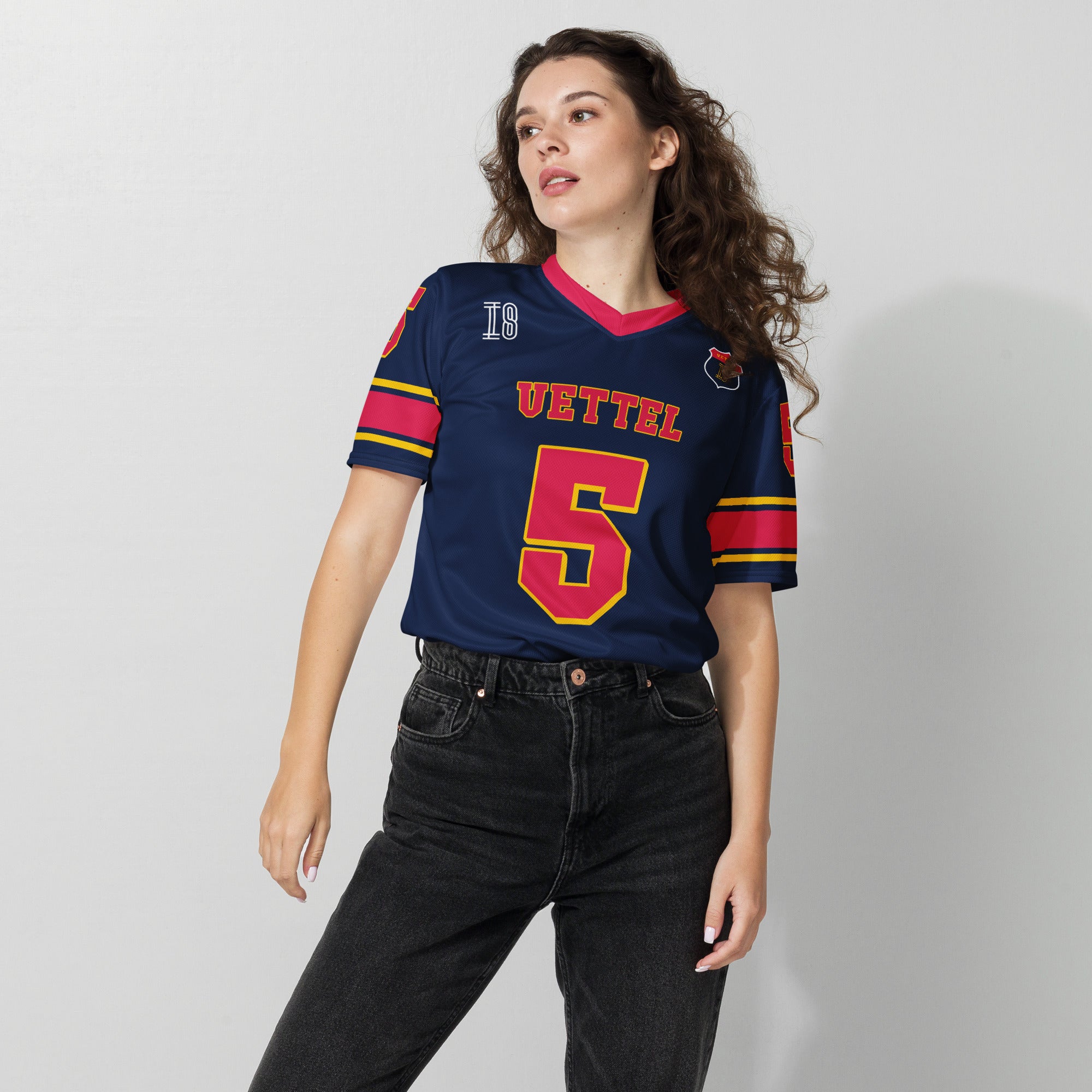 A navy blue football jersey with sebastian vetel redbull  F1 Racing number 5 on the front and back.